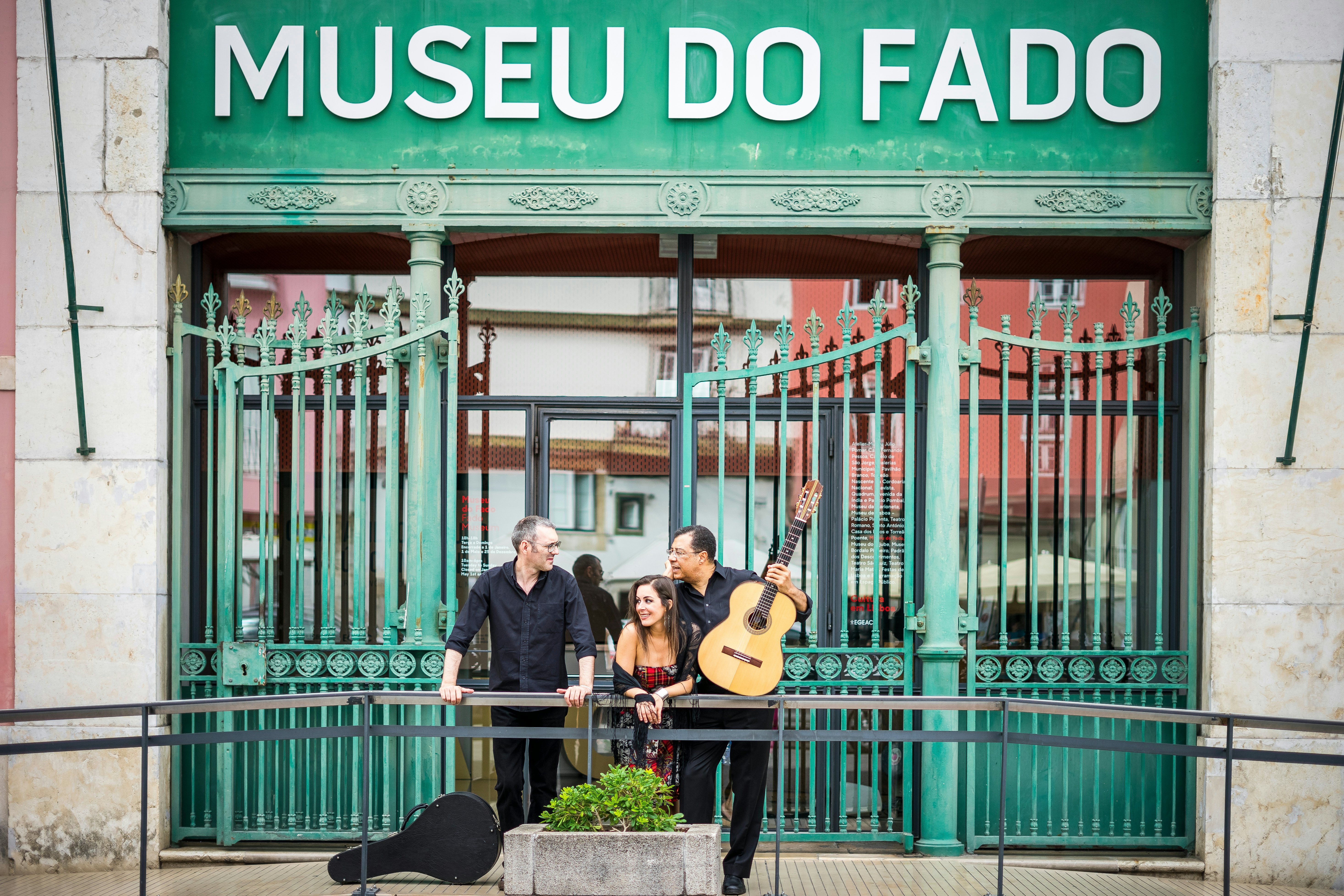 Portuguese guitar player, fado singer and acoustic guitar player in front of Fado Museum in Lisbon