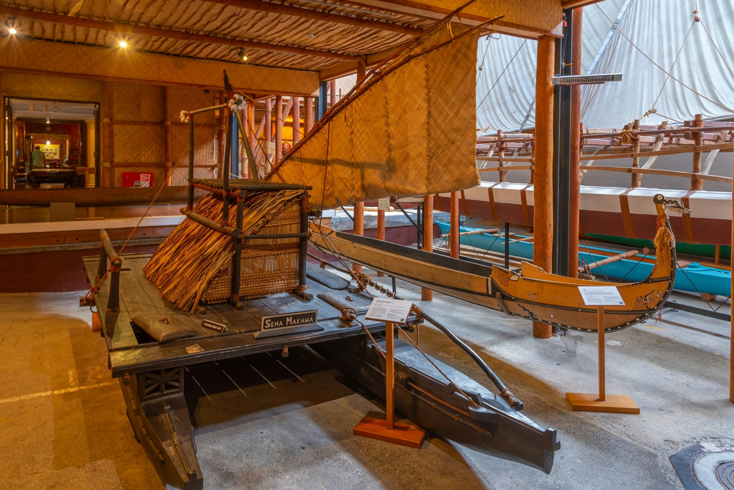 A model of a traditional vessel inside a museum in Auckland, New Zealand.