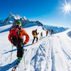 A group of skiers start the descent of Valle Blanche, the most famous offpist run in the Alps, Valle Blanche descent links Italy and France through the Mont Blanc Massif. Chamonix, France, Europe. License Type: media Download Time: 2024-02-02T18:58:08.000Z User: aniabartoszek Is Editorial: No purchase_order: