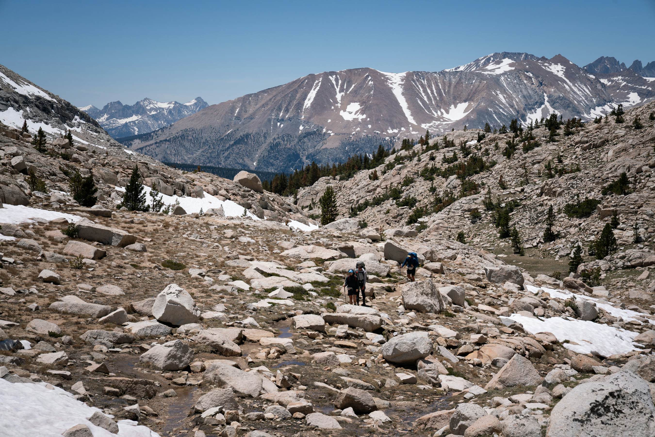 Huge bolders along a hiking trail in a mountain pass.