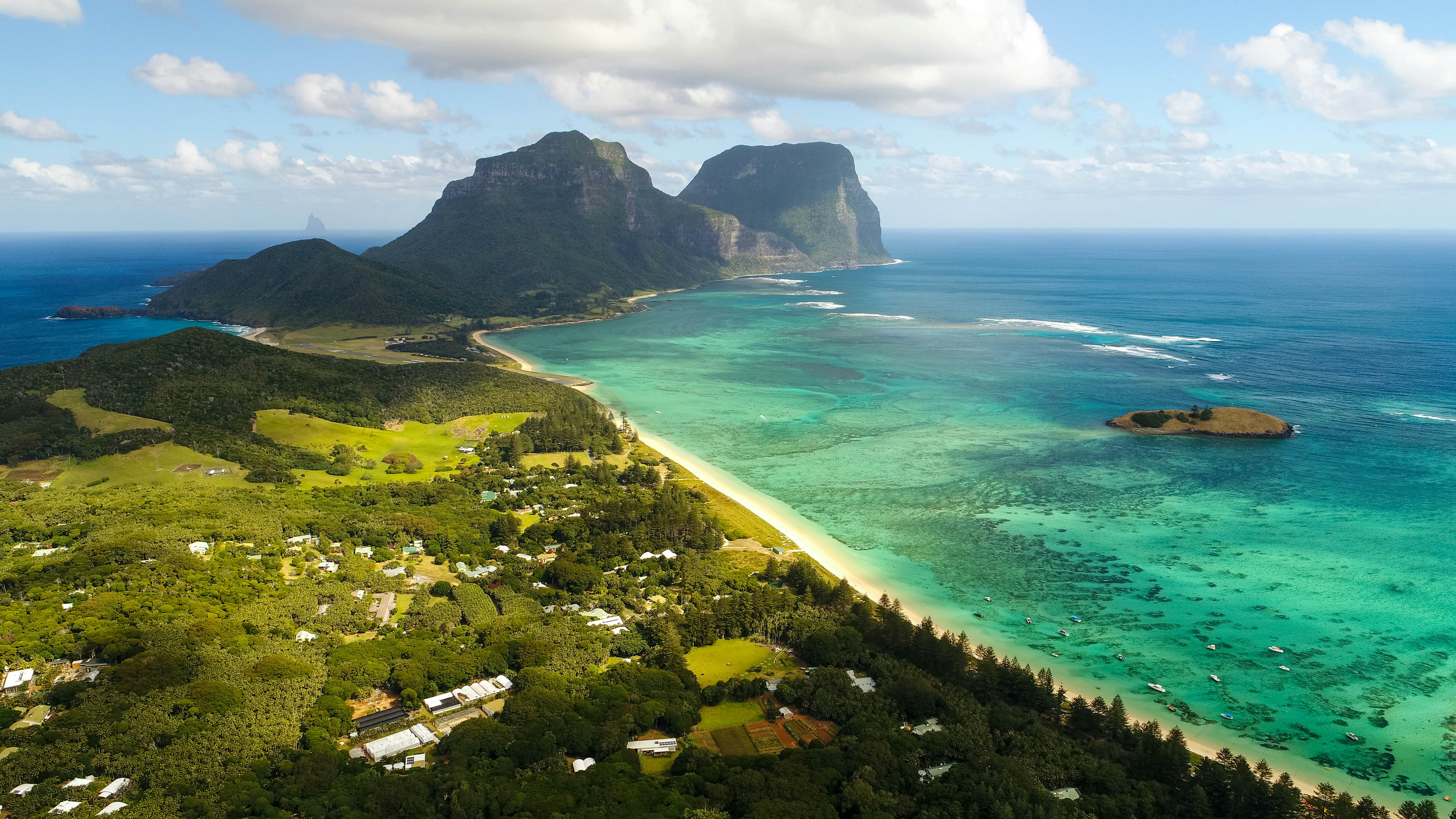 Aerial view of Lord Howe Island (World Heritage-listed paradise), turquoise blue lagoon and Mount Gower on background - New South Wales - Tasman Sea - Australia from above, License Type: media, Download Time: 2025-05-22T13:28:00.000Z, User: lonelyplanetmedia, Editorial: false, purchase_order: 65050 - Digital Destinations and Articles, job: Global Publishing WIP, client: Global Publishing WIP, other: Pia Peterson Haggarty // SS Comp Ingestion