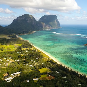 Aerial view of Lord Howe Island (World Heritage-listed paradise), turquoise blue lagoon and Mount Gower on background - New South Wales - Tasman Sea - Australia from above, License Type: media, Download Time: 2025-05-22T13:28:00.000Z, User: lonelyplanetmedia, Editorial: false, purchase_order: 65050 - Digital Destinations and Articles, job: Global Publishing WIP, client: Global Publishing WIP, other: Pia Peterson Haggarty // SS Comp Ingestion