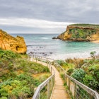 Sunny cloudy summer coast view to the wild wave Bass Strait with beautiful sandy beach path and rocky erosion cliffs of the Great Ocean Road limestone formations Childers Cove, Warrnambool,  Australia, License Type: media, Download Time: 2025-05-22T13:28:01.000Z, User: lonelyplanetmedia, Editorial: false, purchase_order: 65050 - Digital Destinations and Articles, job: Global Publishing WIP, client: Global Publishing WIP, other: Pia Peterson Haggarty // SS Comp Ingestion