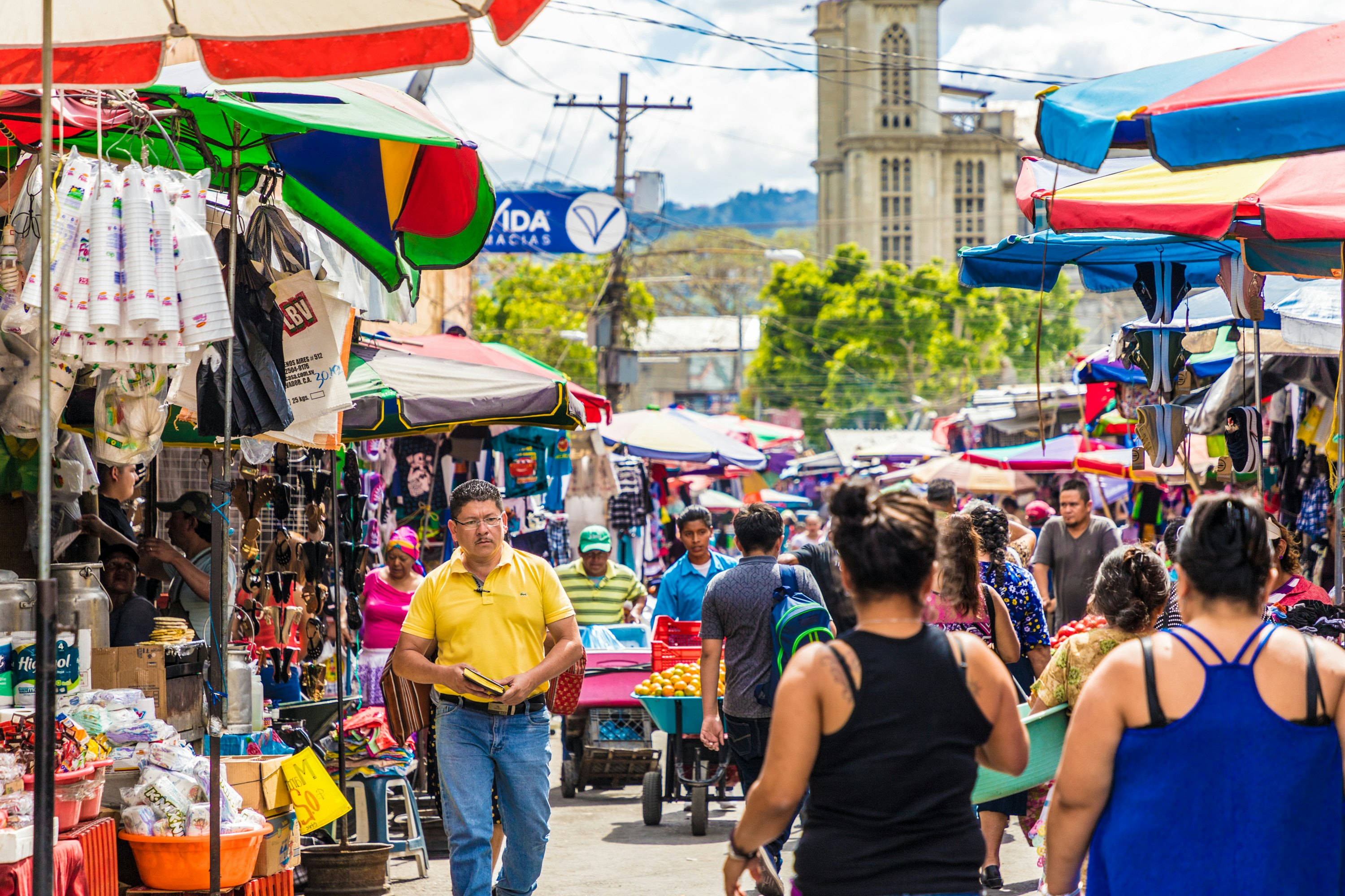People walking through a street market.