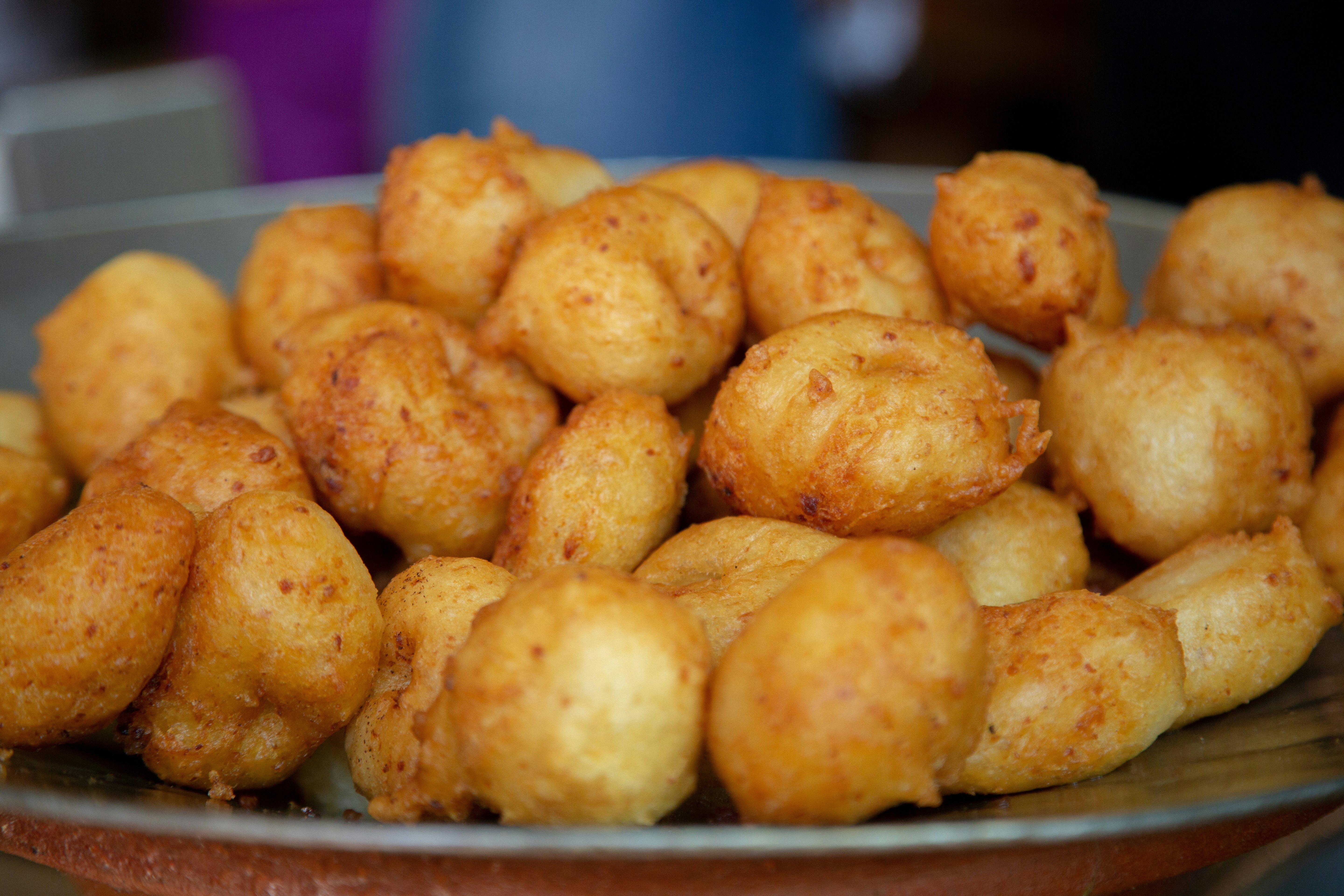 Buñuelos, round doughnuts balls made from a potato or cassava dough and cooked in hot oil. Traditional snack popular in Spain and Latin America.