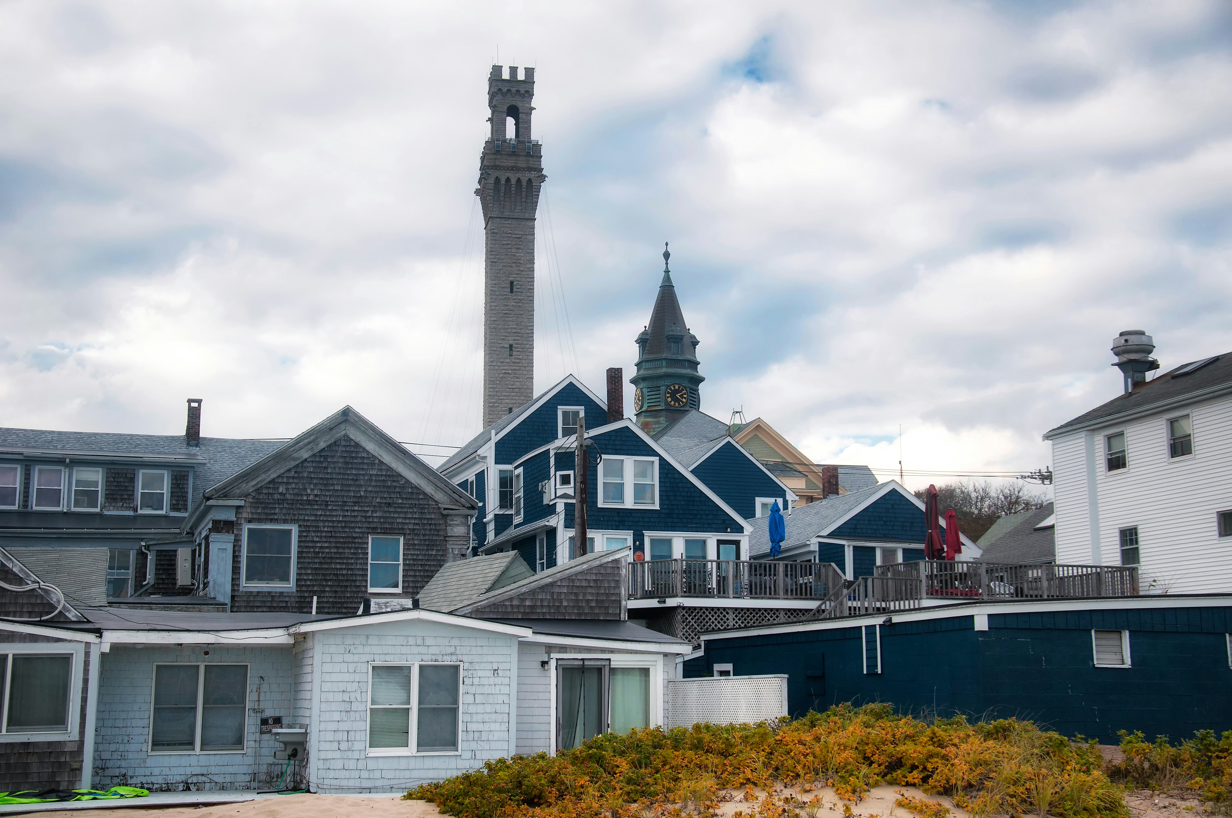 The historic landmark pilgrim monument and town hall rising above Provincetown massachusetts on a new england autumn day