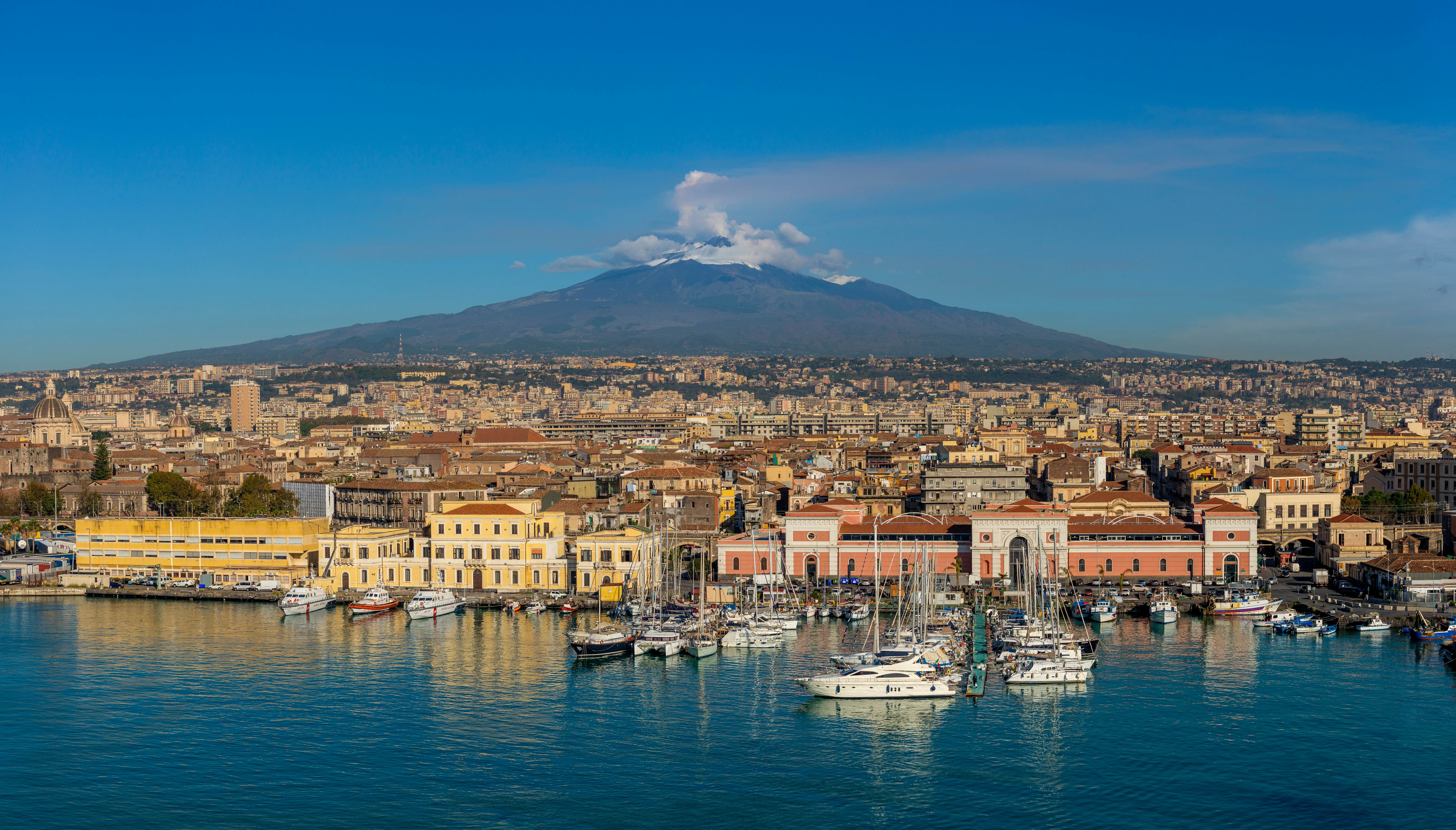 Port of Catania, Sicily. Mount Etna in the background., License Type: media, Download Time: 2024-12-30T03:13:08.000Z, User: hannahblackie10, Editorial: false, purchase_order: 56530 - Guidebooks, job: Global Publishing WIP, client: Sicily 11, other: Hannah Blackie