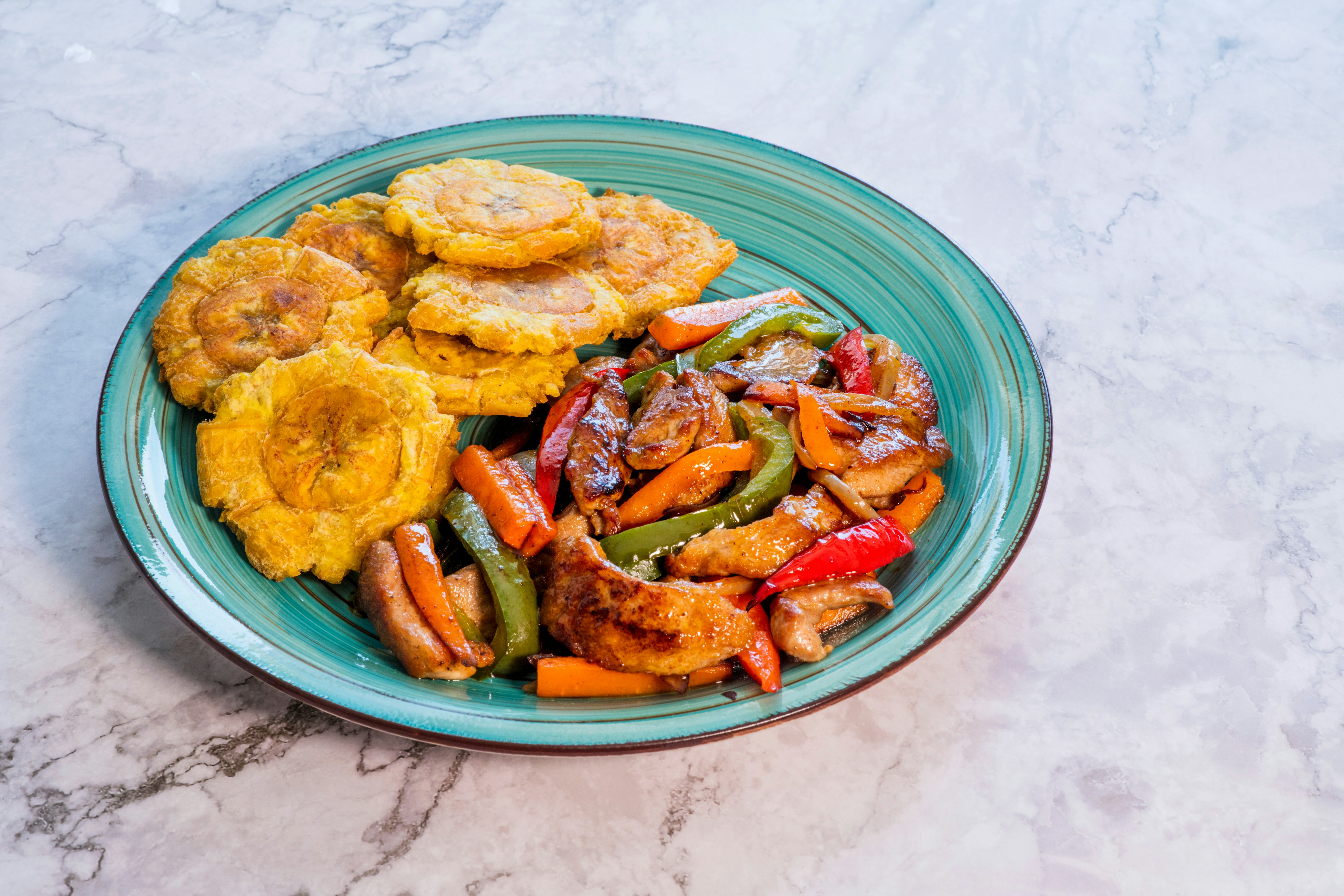 Chopped steak or Bistec Picao and patacones or tostones are fried green plantain slices, made with green plantains