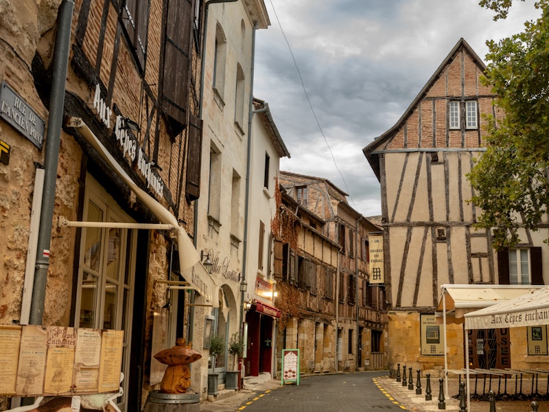 A medieval French village with half-timbered buildings turned into shops and restaurants