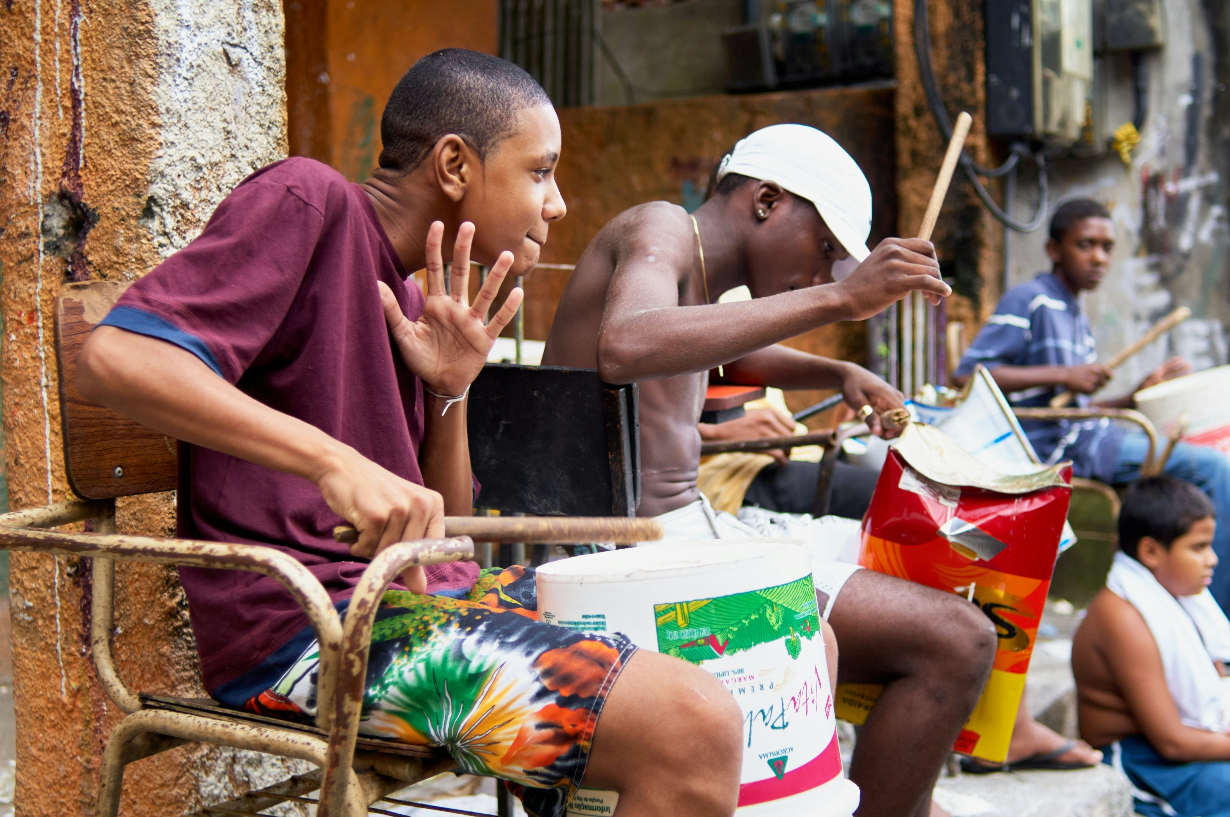 Rocinha Rio De Janeiro Brazil - Group of boys playing drums at alley way at Rocinha.
