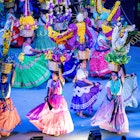 MEXICO, MX - Jul 18, 2019: A group of young females in colorful dresses dancing with baskets full of flowers during Guelaguetza, License Type: media, Download Time: 2025-10-09T02:15:51.000Z, User: bhealy950, Editorial: true, purchase_order: 65050 - Digital Destinations and Articles, job: Lonely Planet Online Editorial, client: Best things to do in Oaxaca, other: Brian Healy
