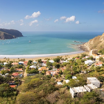 Bay with blue water in Nicaragua San Juan Del Sur aerial drone view on golden time of sunrise; Shutterstock ID 2341825871; purchase_order:65050 - Digital Destinations and Articles; job:Editorial; client:Top things San Juan del Sur; other:Alison Gonner
2341825871