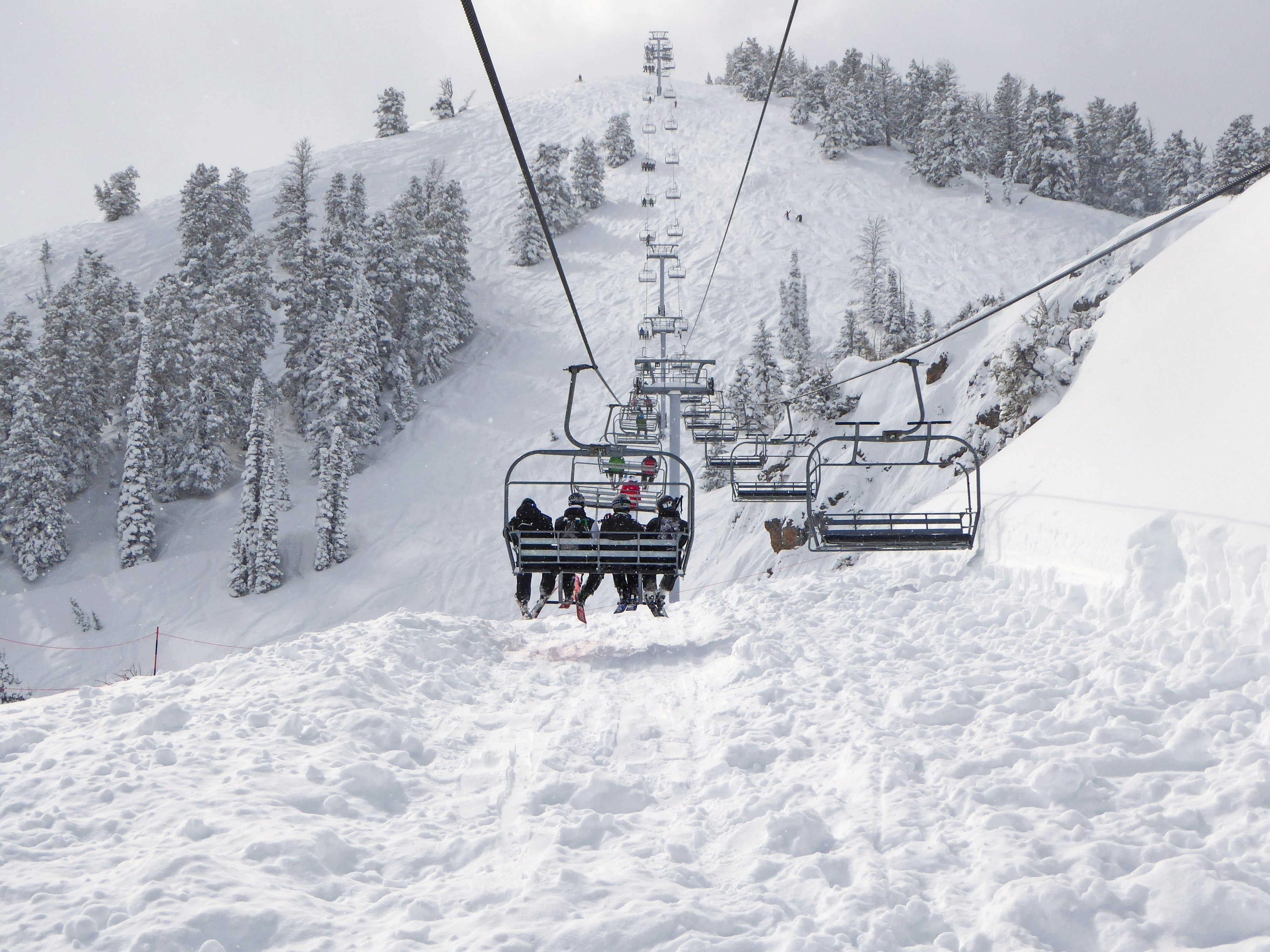 Group of skiers on a chair lift.