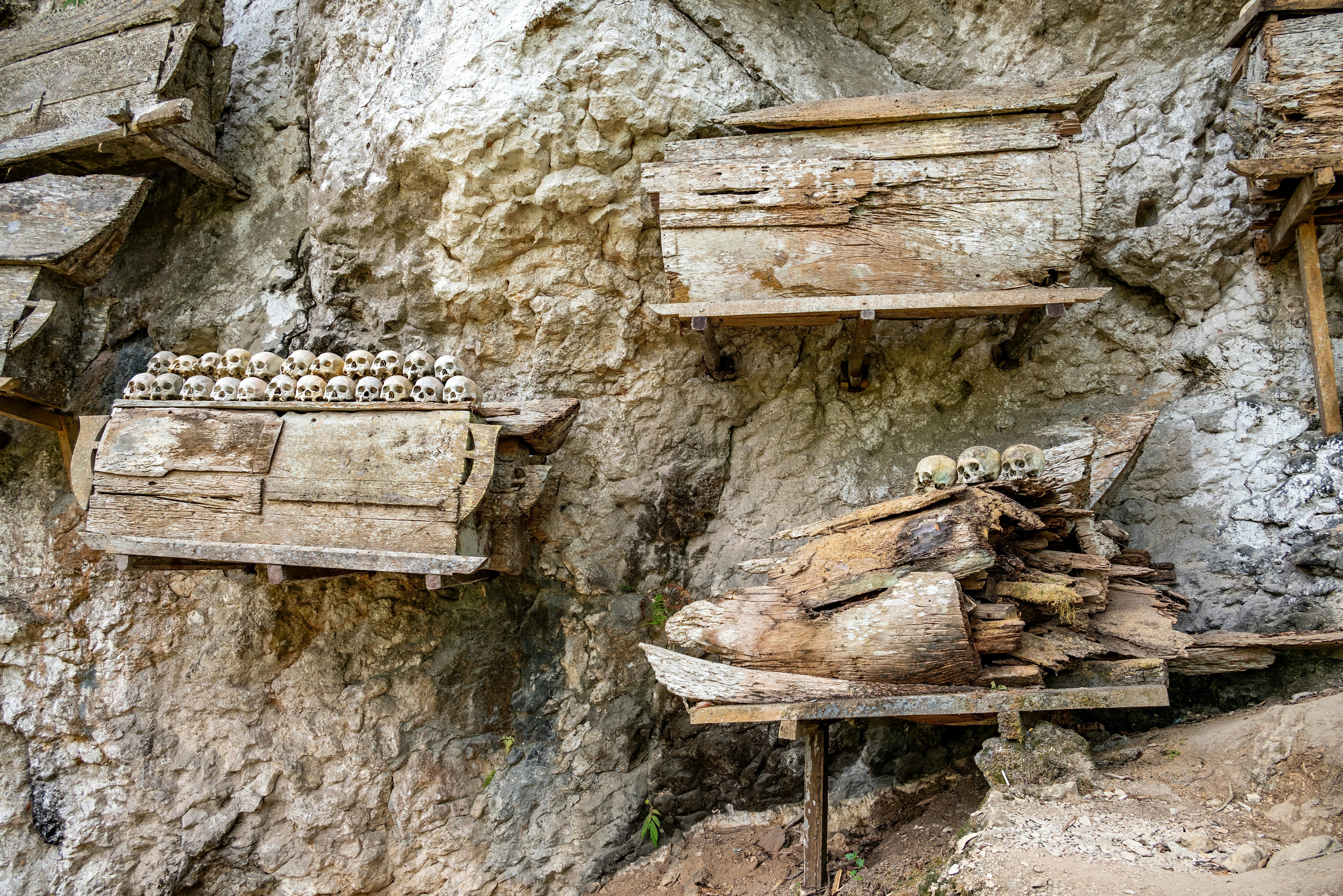 Skulls, bones and hanging coffins at the cliffside burial site at Ke'te Kesu' in Tana Toraja, Sulawesi, Indonesia.
