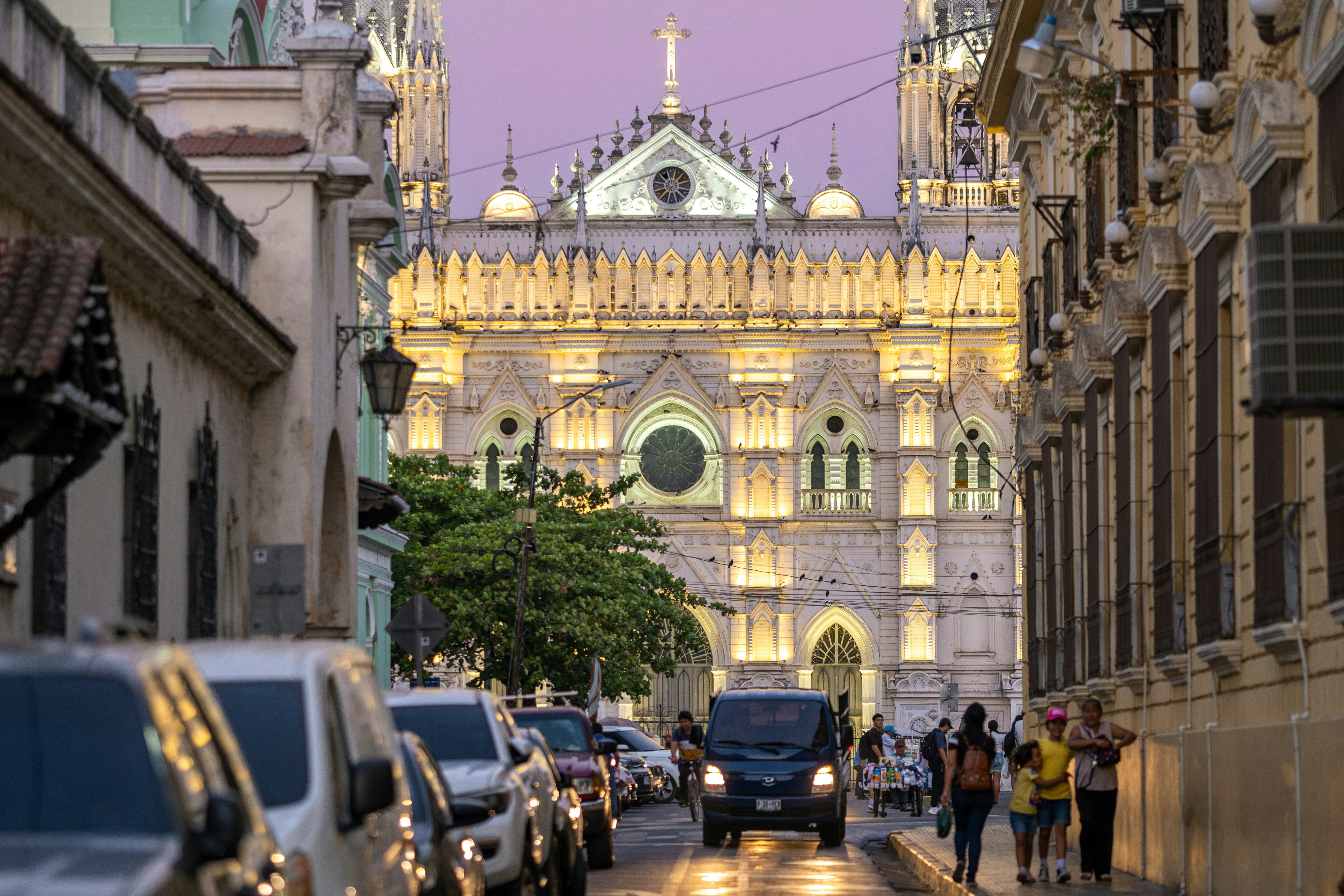 The illuminated frontage of an ornate cathedral