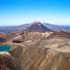 Aerial view of Tongariro National Park, North Island, New Zealand, Oceania.Blue Lake and Mount Tongariro in the foreground, Mount Ngauruhoe and Mount Ruapehu in the background., License Type: media, Download Time: 2025-05-28T10:02:54.000Z, User: lonelyplanetmedia, Editorial: false, purchase_order: 65050 - Digital Destinations and Articles, job: Global Publishing WIP, client: Global Publishing WIP, other: Peterson Haggarty // SS Comp Ingestion