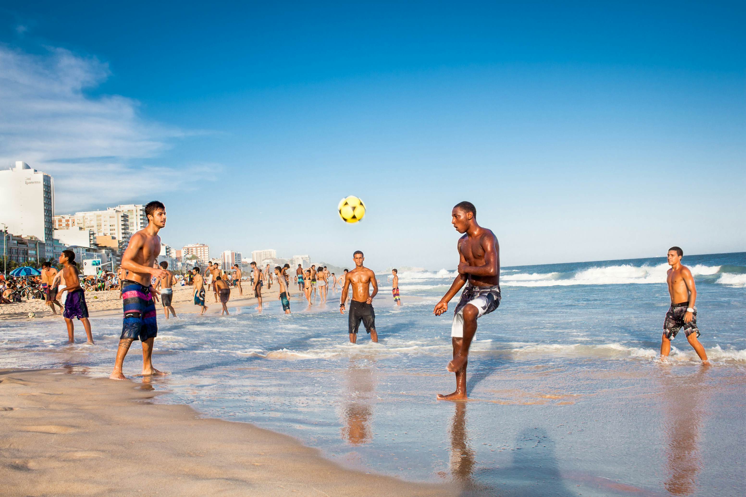 RIO DE JANEIRO, BRAZIL - APRIL 24, 2015: Carioca Brazilians playing altinho futebol beach football kicking soccer balls at sunset Ipanema Beach on April 24, 2015, Rio de Janeiro. Brazil., License Type: media, Download Time: 2025-05-28T09:45:19.000Z, User: lonelyplanetmedia, Editorial: true, purchase_order: 65050 - Digital Destinations and Articles, job: Global Publishing WIP, client: Global Publishing WIP, other: Peterson Haggarty // SS Comp Ingestion
