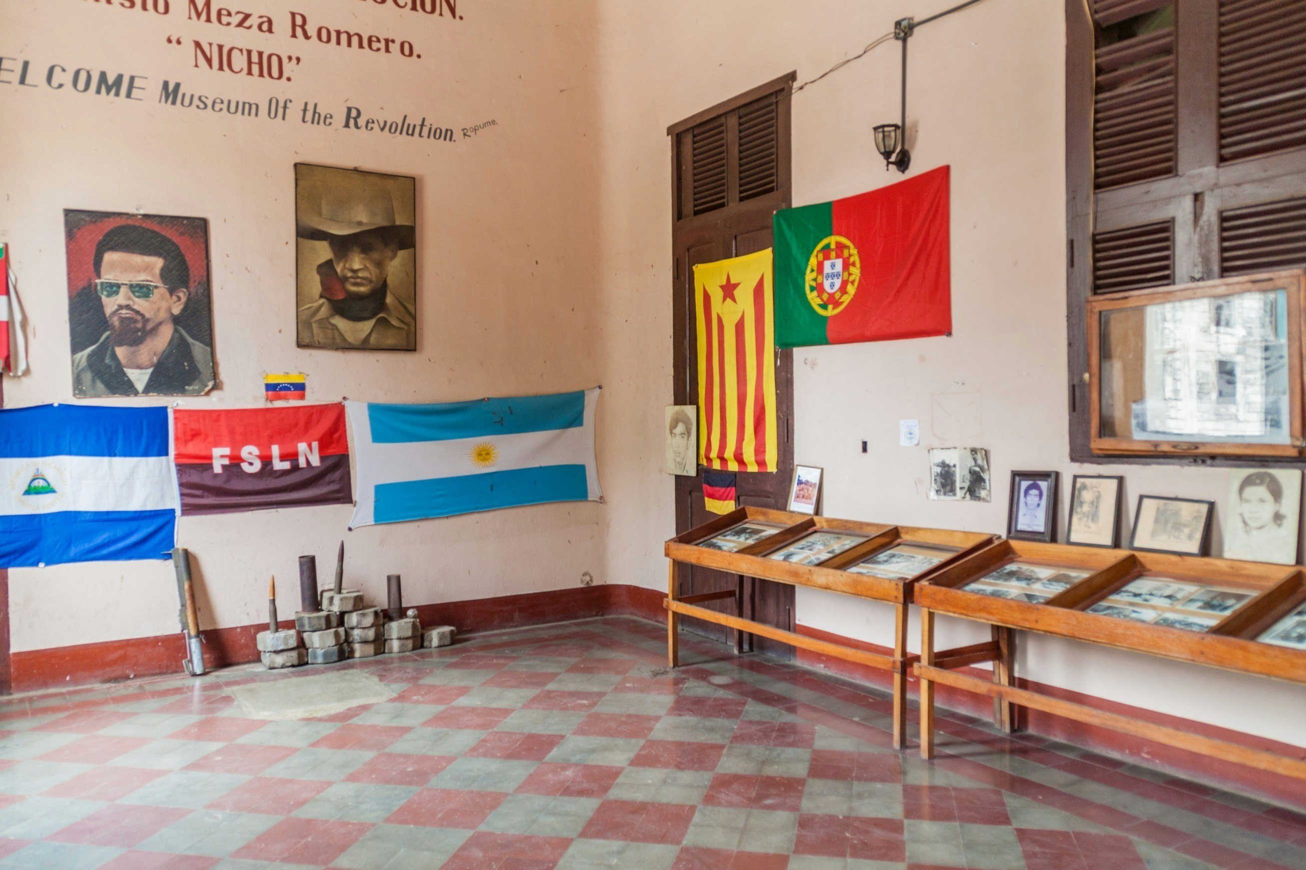 Exhibits including portraits and flags at the Museo de la Revolución