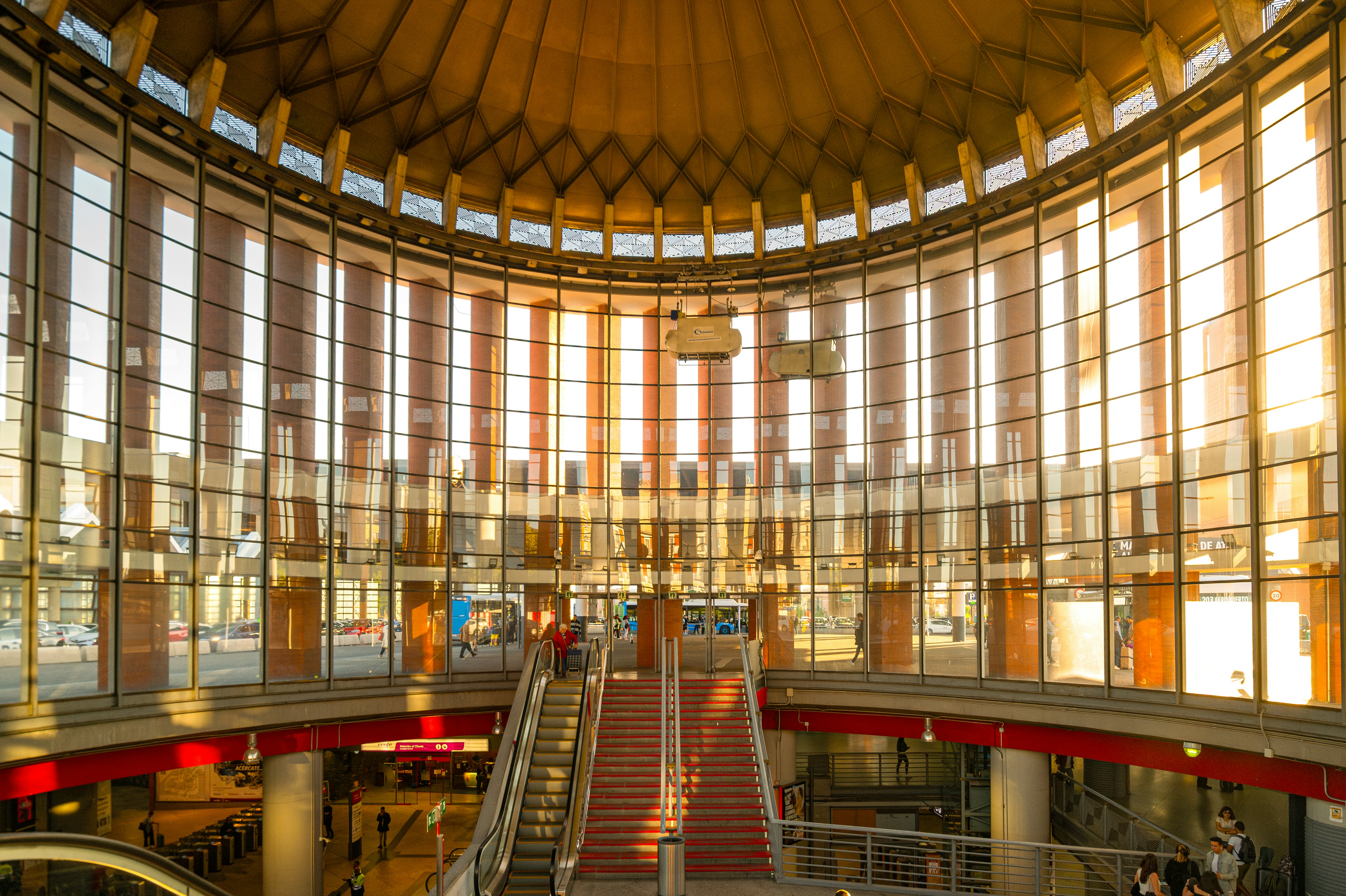 A train station with large, sunny windows.