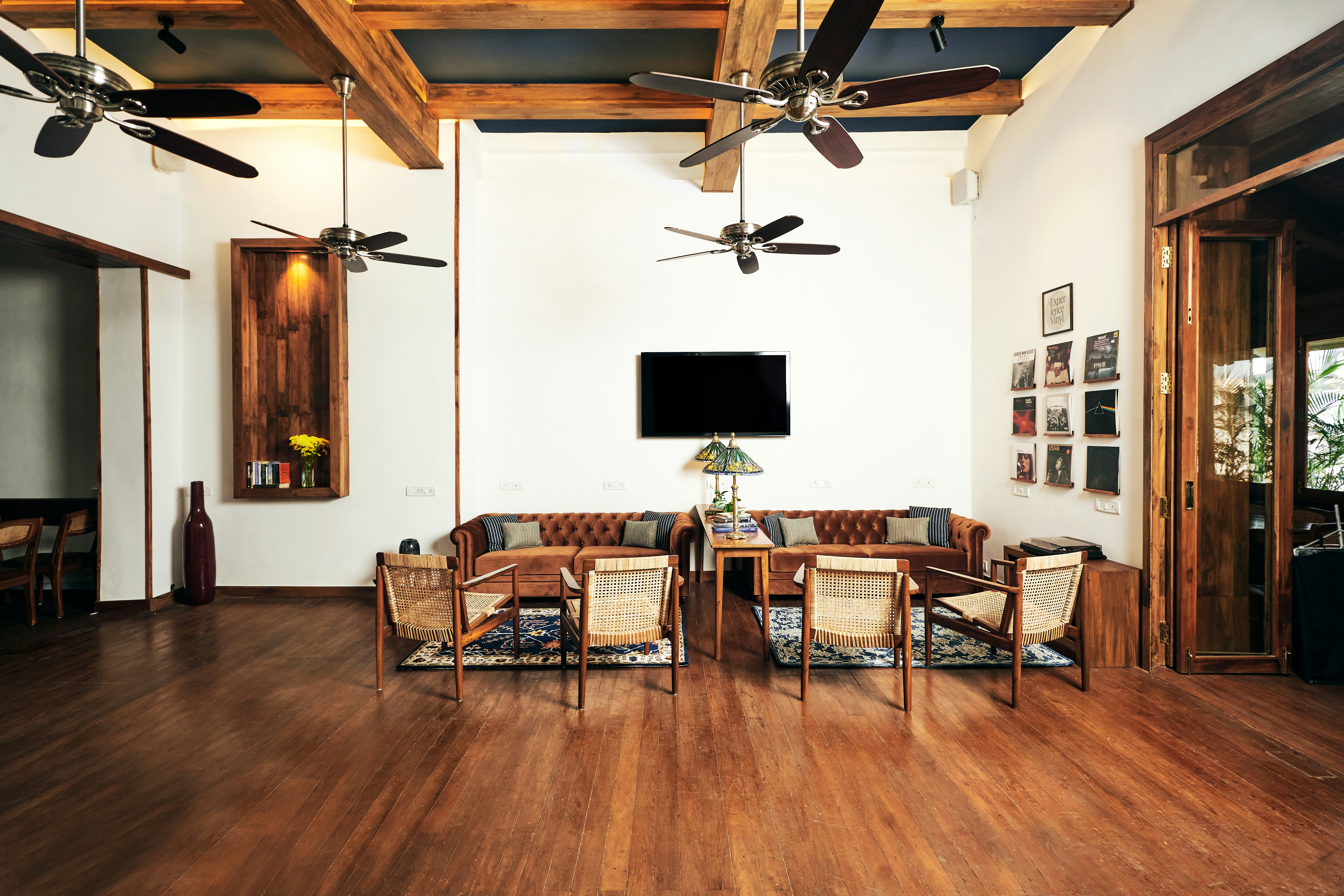 A wooden floored shared space in Abode Bombay