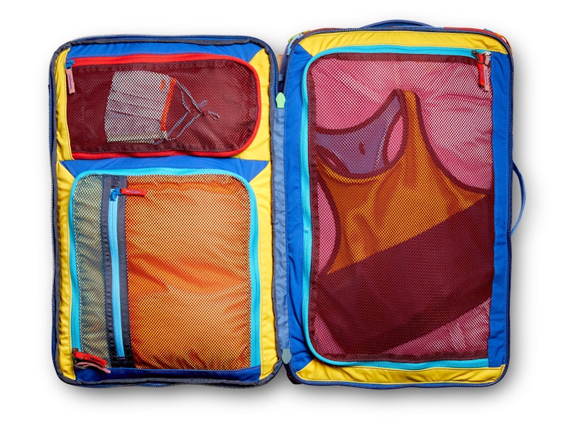 Multicolored mesh pockets in an opened bag.