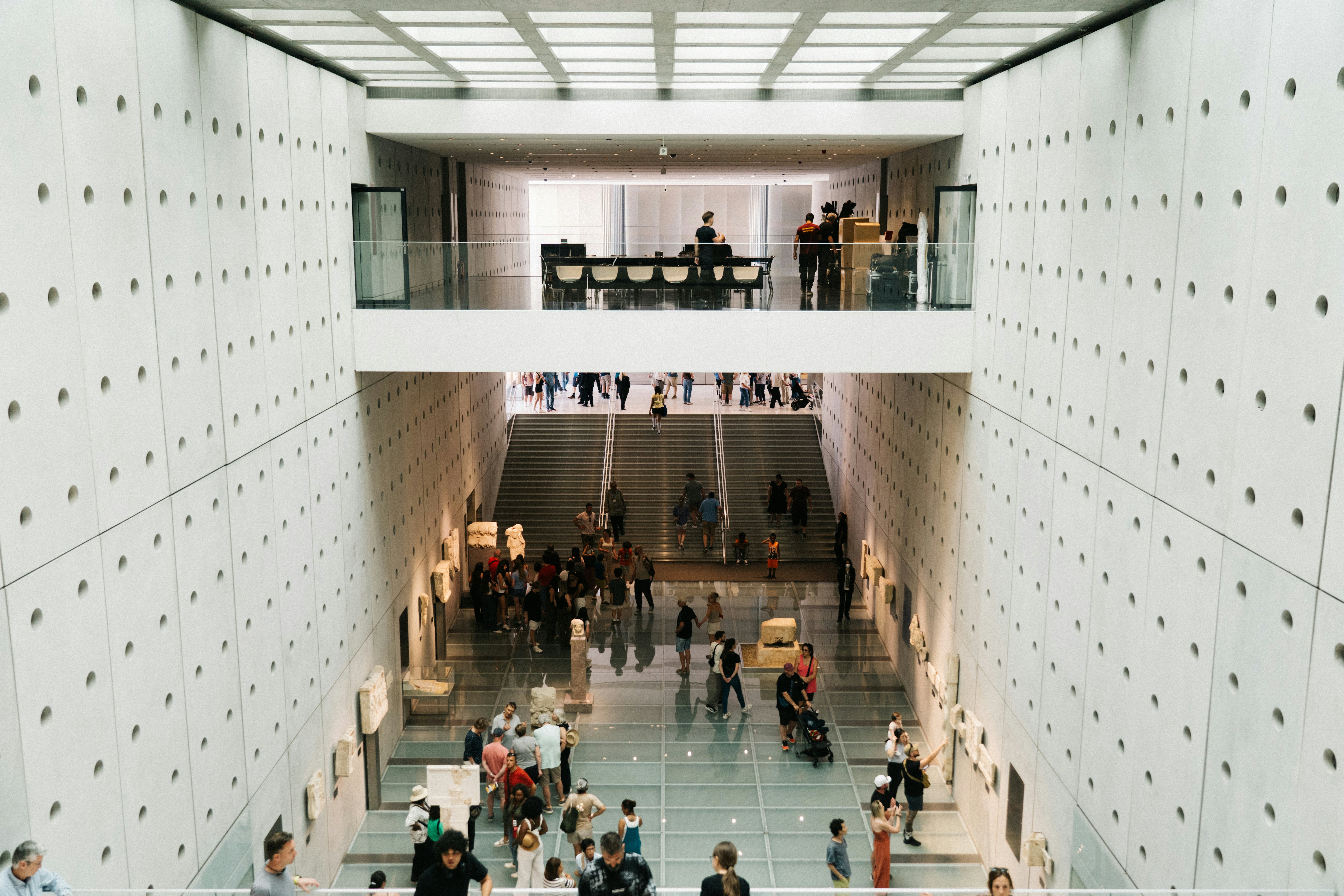 People walking in a brightly lit museum