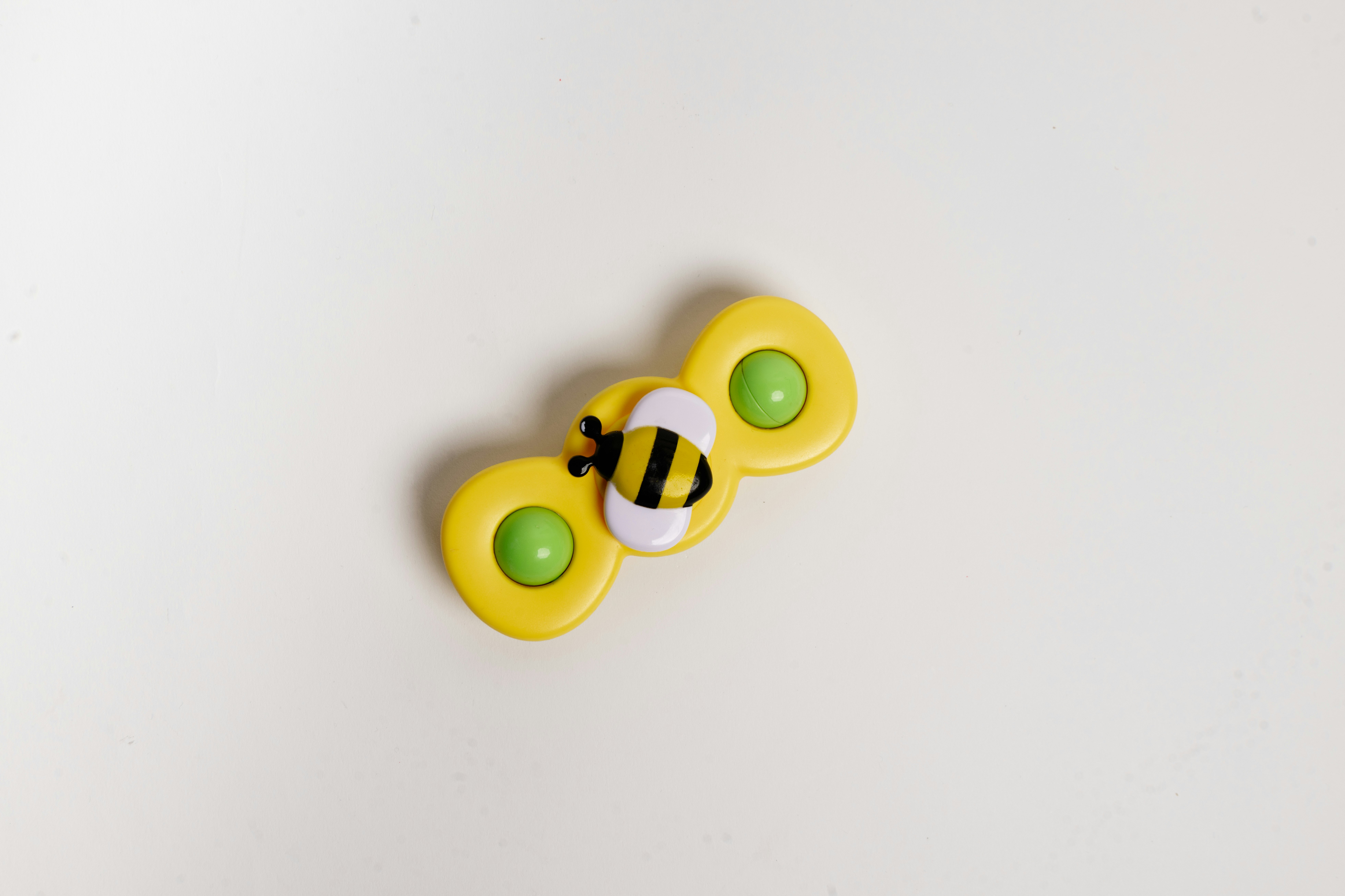A spinner with a bee on it.
