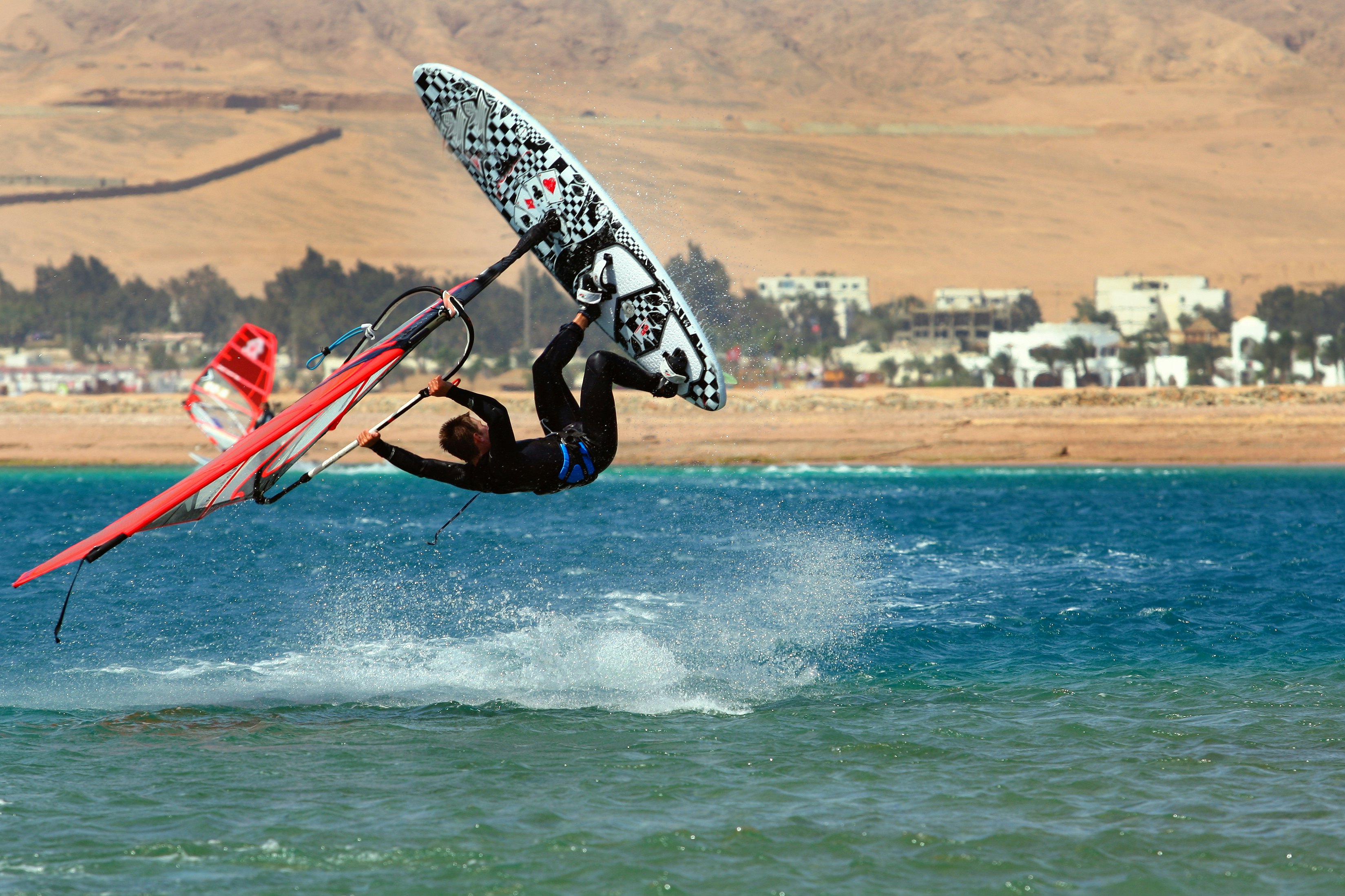A windsurfer on the coast at Dahab in the Sinai Peninsula, Egypt.
