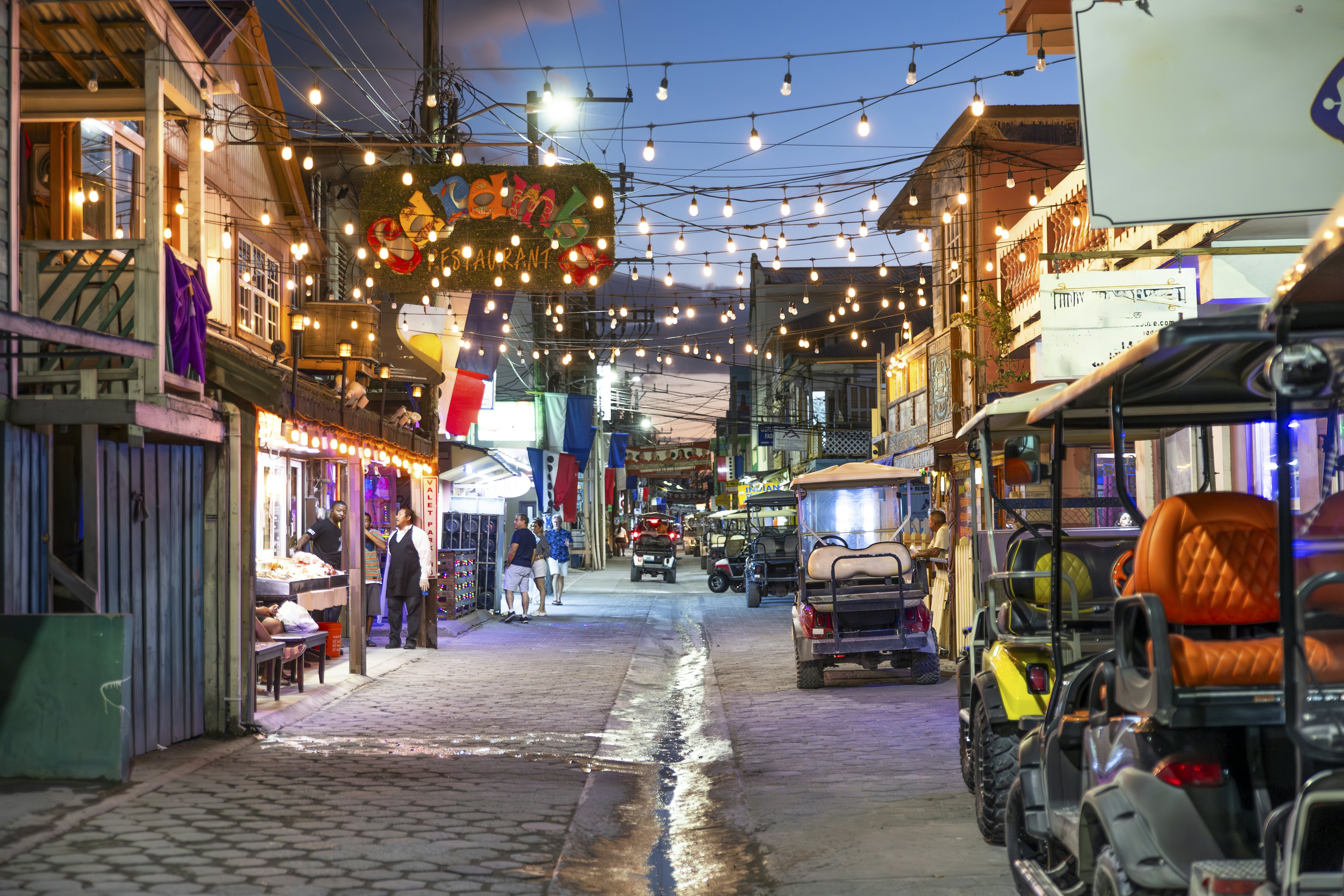 Ambergris Caye, San Pedro, Belize - A famous street in San Pedro. Restaurants line the street offering fresh seafood and many other styles of local food.