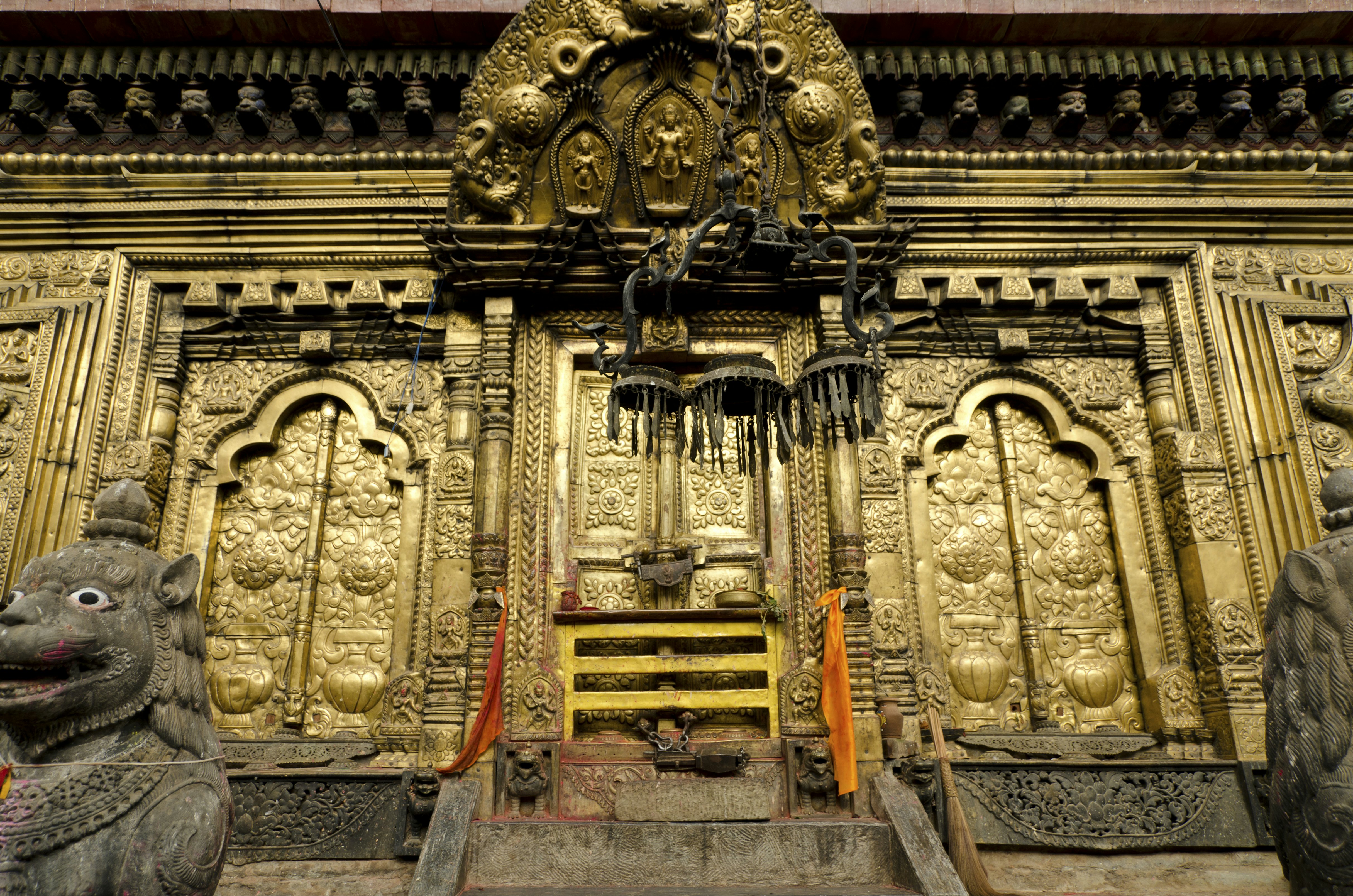 A gold plated metal door of a temple