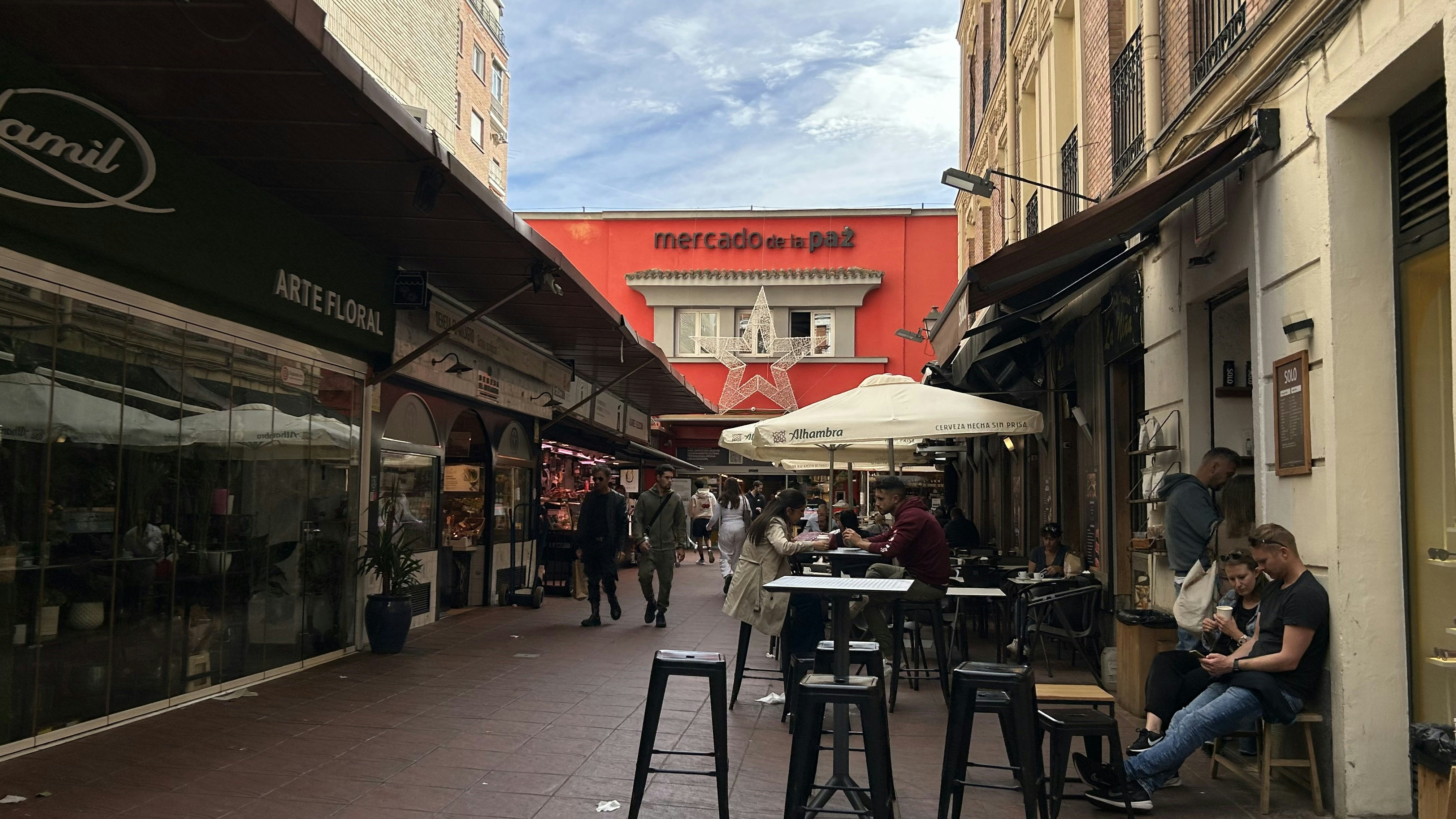 A promenade leading up to the entrance of a market