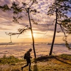 LOEI, THAILAND, OCTOBER 7, 2017: Tourists are see the sunrise at view point Nok Aen Cliff at Phu Kradueng National Park. License Type: media Download Time: 2023-11-14T07:39:07.000Z User: lonelyplanetmedia Is Editorial: Yes purchase_order: