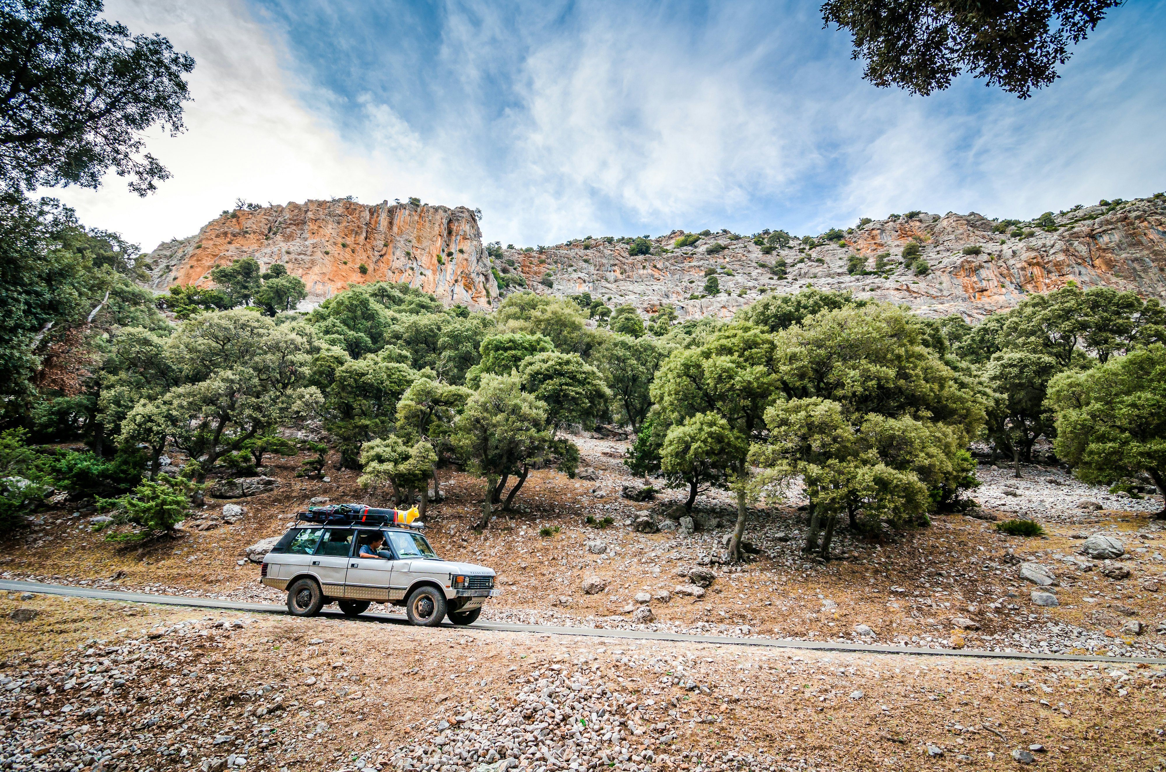 Vintage off road car going in road in Tazekka National Park, Morocco