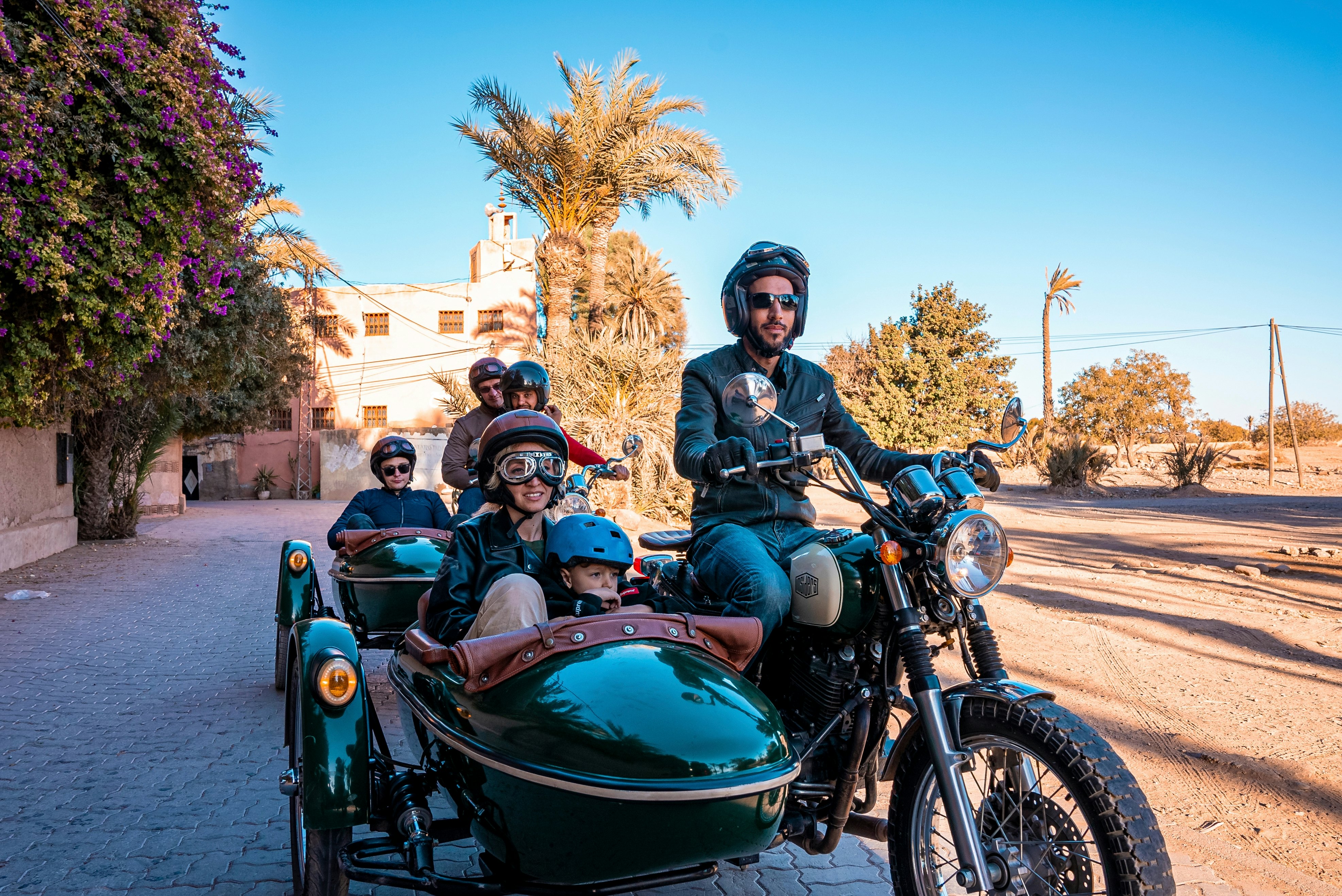 Marrakesh, Morocco. People riding motorcycle with sidecar during road trip