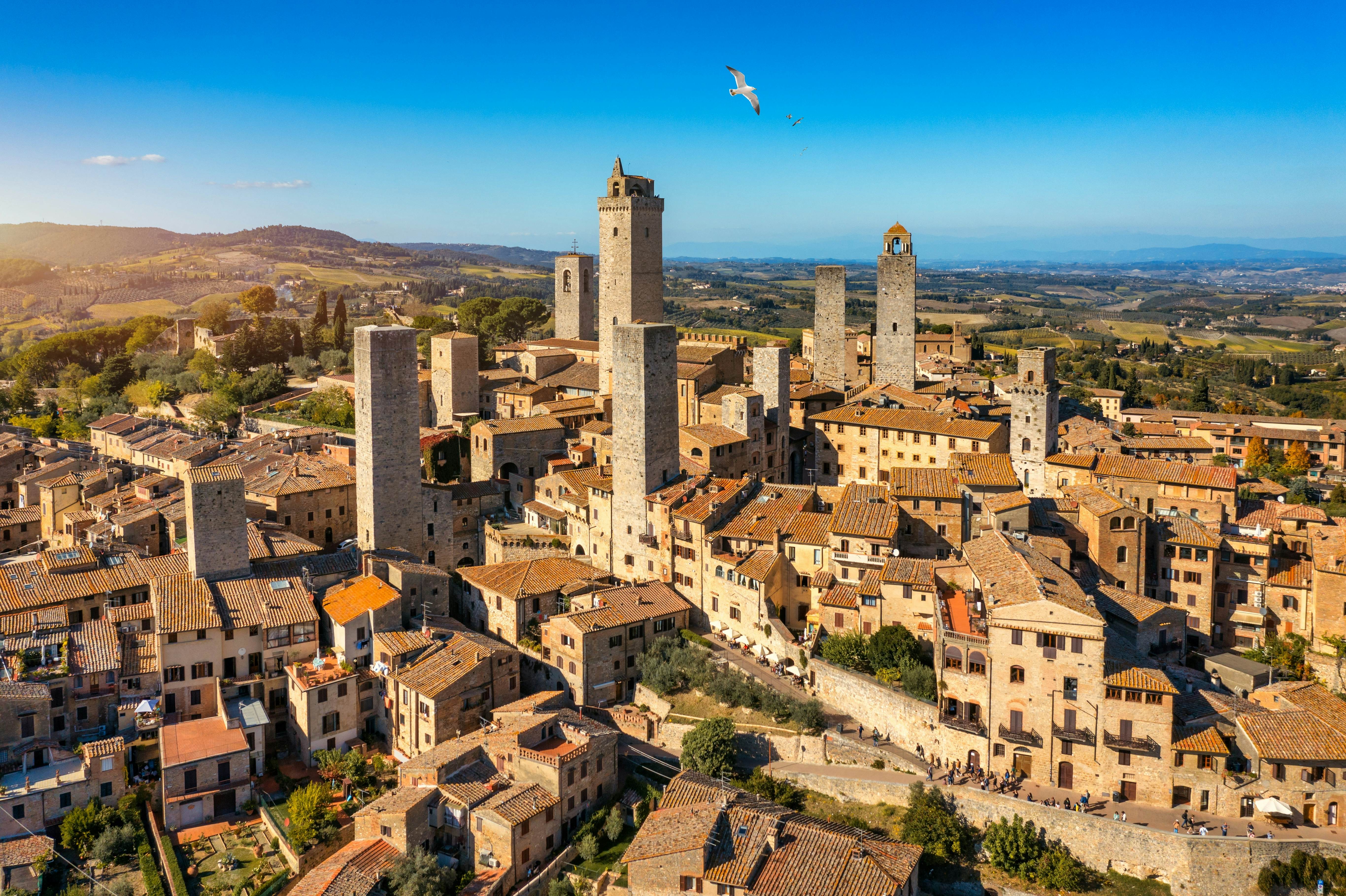 Town of San Gimignano, Tuscany, Italy with its famous medieval towers. Aerial view of the medieval village of San Gimignano, a Unesco World Heritage Site. Italy, Tuscany, Val d'Elsa.  License Type: media  Download Time: 2023-02-21T04:55:10.000Z  User: claramonitto  Is Editorial: No  purchase_order:   