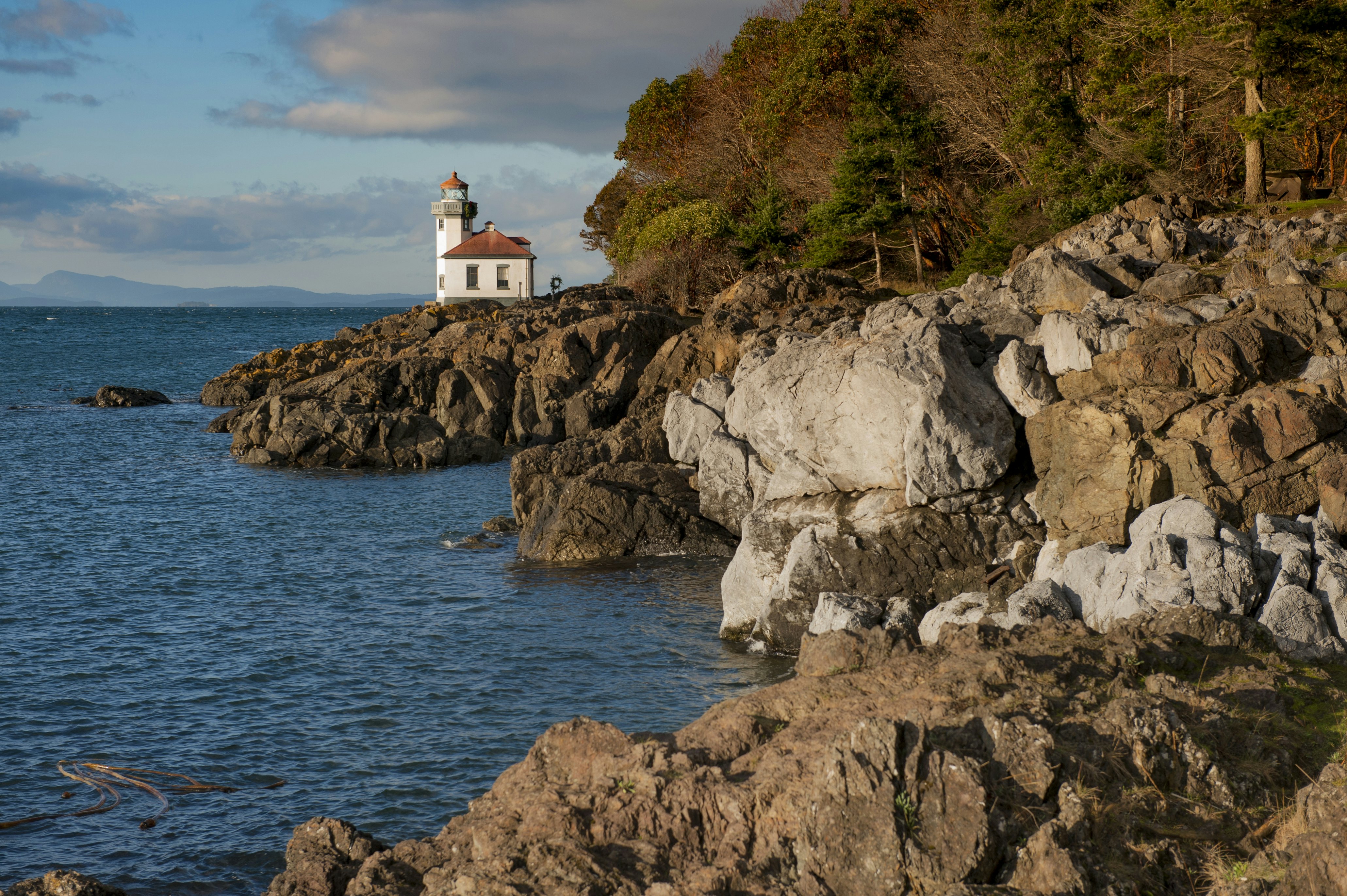 Lime Kiln Lighthouse. Located on San Juan Island, in Washington state, It guides ships through the Haro Straits and is part of Lime Kiln Point State Park. It overlooks Dead Mans Bay.