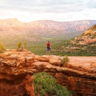 Travel in Devil's Bridge Trail, man Hiker with backpack enjoying view, Sedona, Arizona, USA License Type: media Download Time: 2021-08-19T14:46:36.000Z User: zachary.laks_lonelyplanet Is Editorial: No purchase_order: