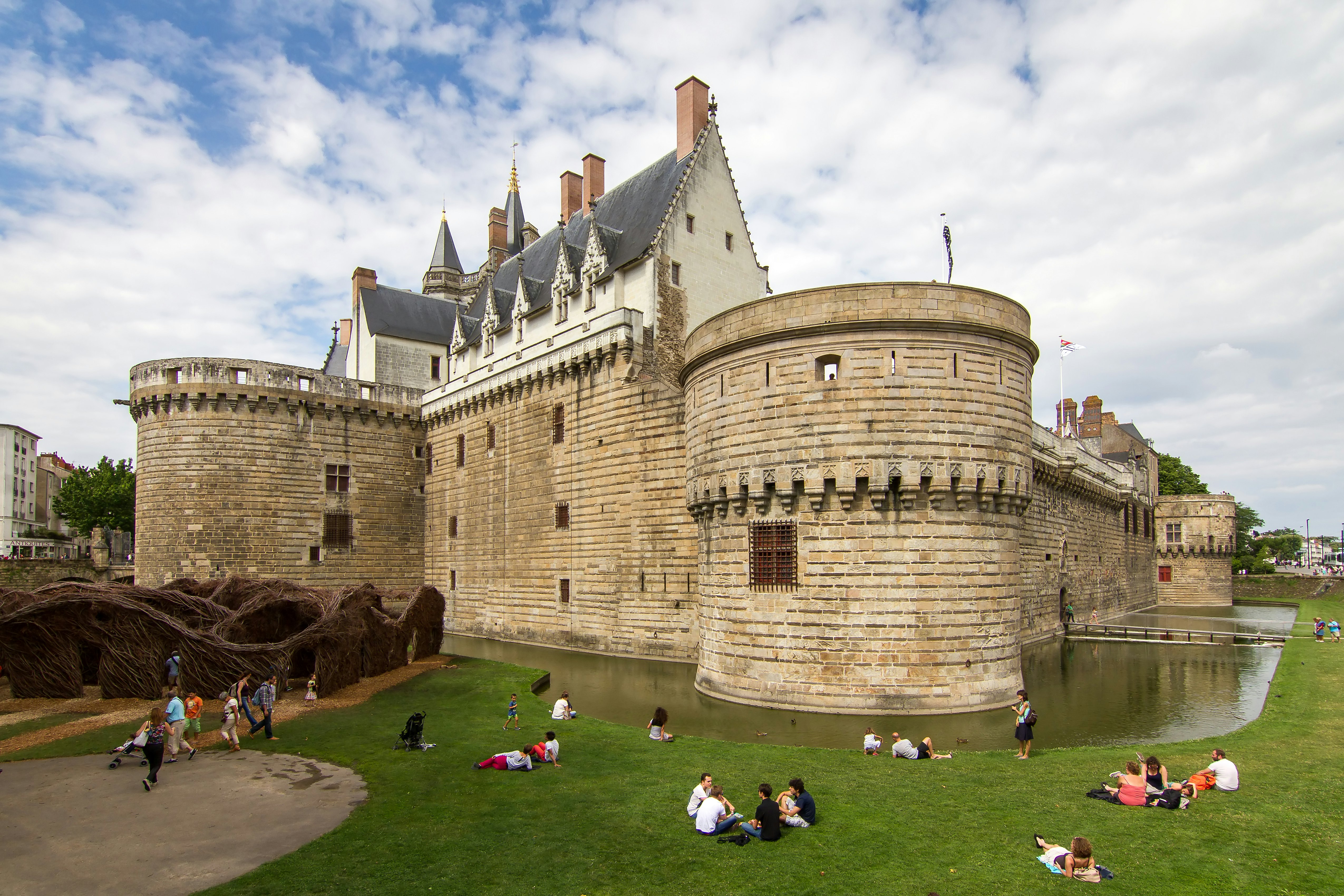 NANTES, FRANCE - JULY 29, 2014: People visiting The Château des ducs de Bretagne (Castle of the Dukes of Brittany) in summer in the city of Nantes, France.