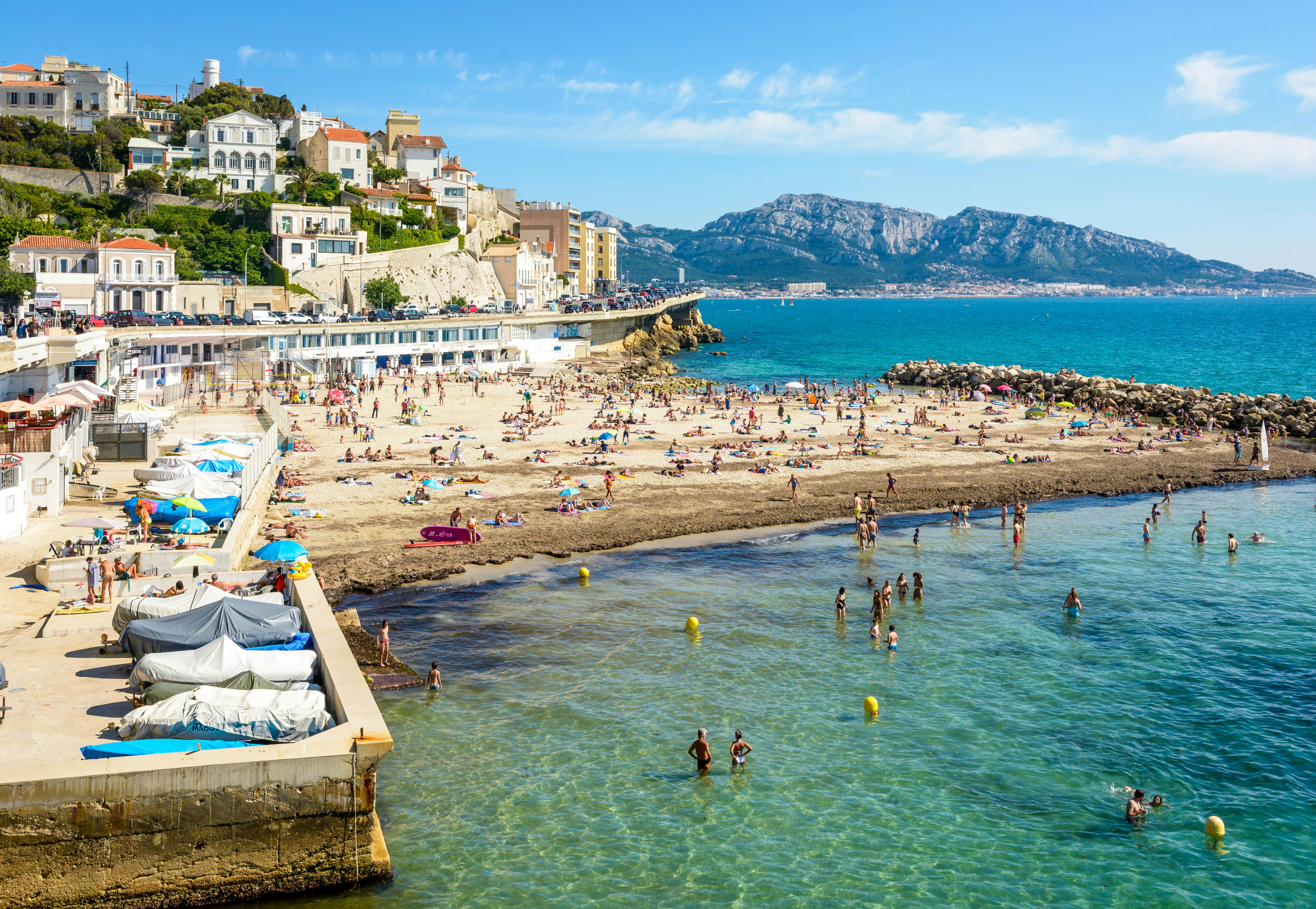 Marseille, France - May 19, 2018: People sunbathing and swimming on the Prophet beach, a very popular family beach located on the Kennedy corniche, on a hot and sunny spring day., License Type: media, Download Time: 2025-11-06T12:53:21.000Z, User: clairenaylor, Editorial: true, purchase_order: 65050 - Digital Destinations and Articles, job: Online editorial, client: Marseille beaches, other: Claire Naylor
