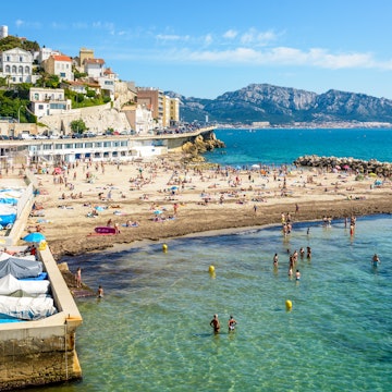 Marseille, France - May 19, 2018: People sunbathing and swimming on the Prophet beach, a very popular family beach located on the Kennedy corniche, on a hot and sunny spring day., License Type: media, Download Time: 2025-11-06T12:53:21.000Z, User: clairenaylor, Editorial: true, purchase_order: 65050 - Digital Destinations and Articles, job: Online editorial, client: Marseille beaches, other: Claire Naylor