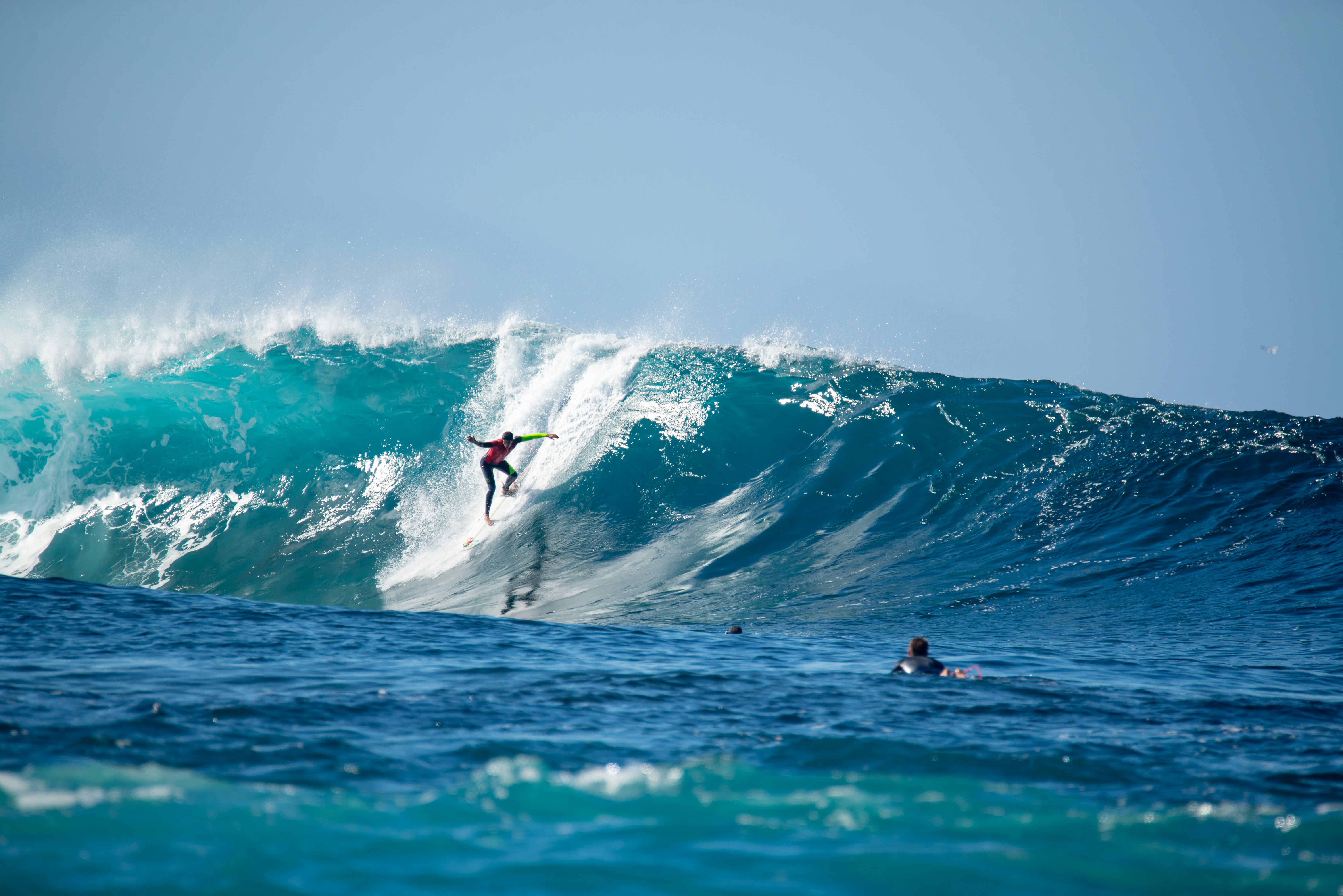 A surfer on a ten-foot tall wave.