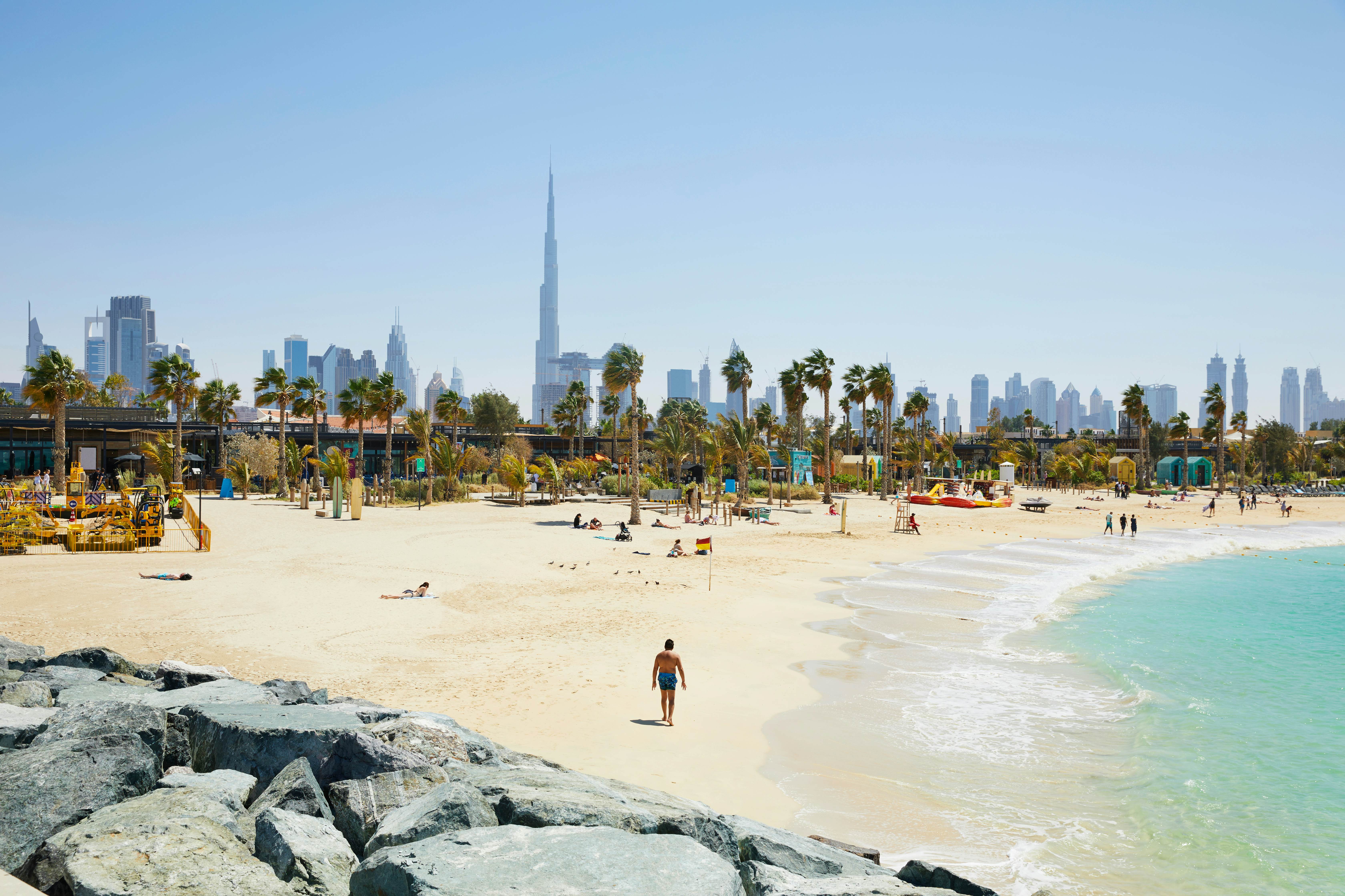 The beach of 'La Mer' (The Sea) with in the background the skyline of Dubai, United Arab Emirates, License Type: media, Download Time: 2025-02-11T20:44:21.000Z, User: Ppeterson948, Editorial: false, purchase_order: 56530 - Guidebooks, job: Global Publishing WIP , client: Global Publishing WIP , other: Pia Peterson Haggarty