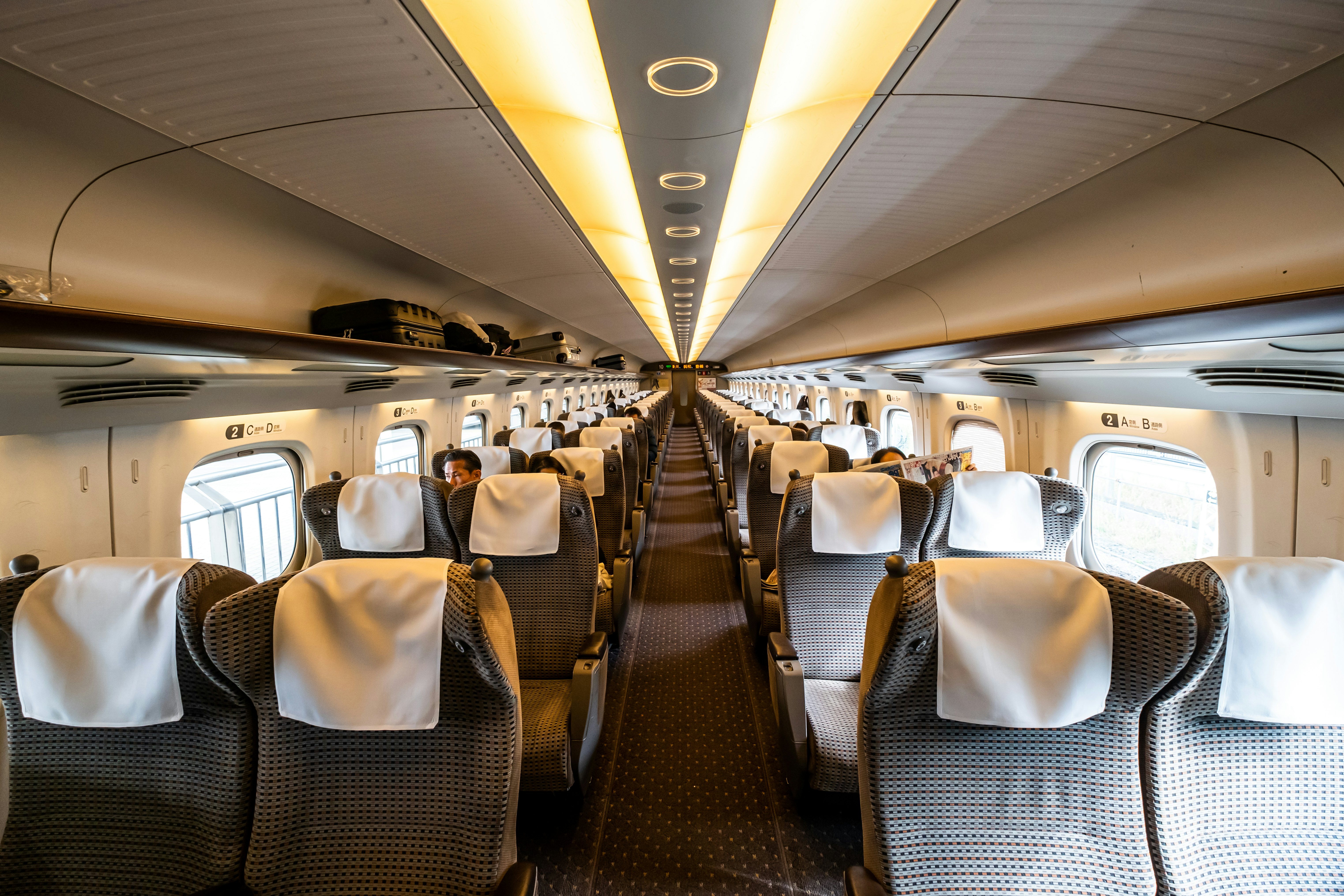 Interior of JR Tokaido / Sanyo Shinkansen N700 series train green car (business class) with comfortable seats