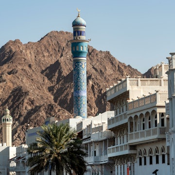 Muscat, Oman. 19th September 2019 The blue mosaic patterned minaret of the Al Lawati Mosque and architecture of Mutrah, Muscat, Oman., License Type: media, Download Time: 2025-01-31T11:54:17.000Z, User: sashabrady26, Editorial: true, purchase_order: 65050 - Digital Destinations and Articles, job: Lonely Planet, client: Photo haul, other: Sasha Brady