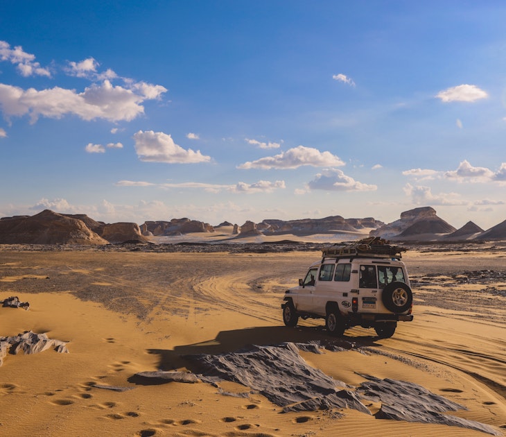 Farafra Oasis, Egypt - November 05, 2021: Adventure 4x4 Car among Beautiful Sand Formations in the White Desert Protected Area in the National Park, License Type: media, Download Time: 2025-07-02T19:16:52.000Z, User: dermothegarty77, Editorial: true, purchase_order: 56530 - Guidebooks, job: Global Publishing WIP, client: Egypt-16, other: Dermot Hegarty