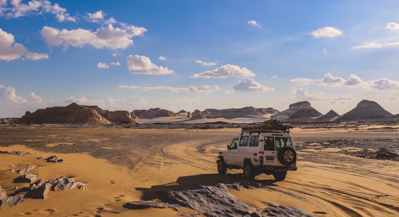 Farafra Oasis, Egypt - November 05, 2021: Adventure 4x4 Car among Beautiful Sand Formations in the White Desert Protected Area in the National Park, License Type: media, Download Time: 2025-07-02T19:16:52.000Z, User: dermothegarty77, Editorial: true, purchase_order: 56530 - Guidebooks, job: Global Publishing WIP, client: Egypt-16, other: Dermot Hegarty