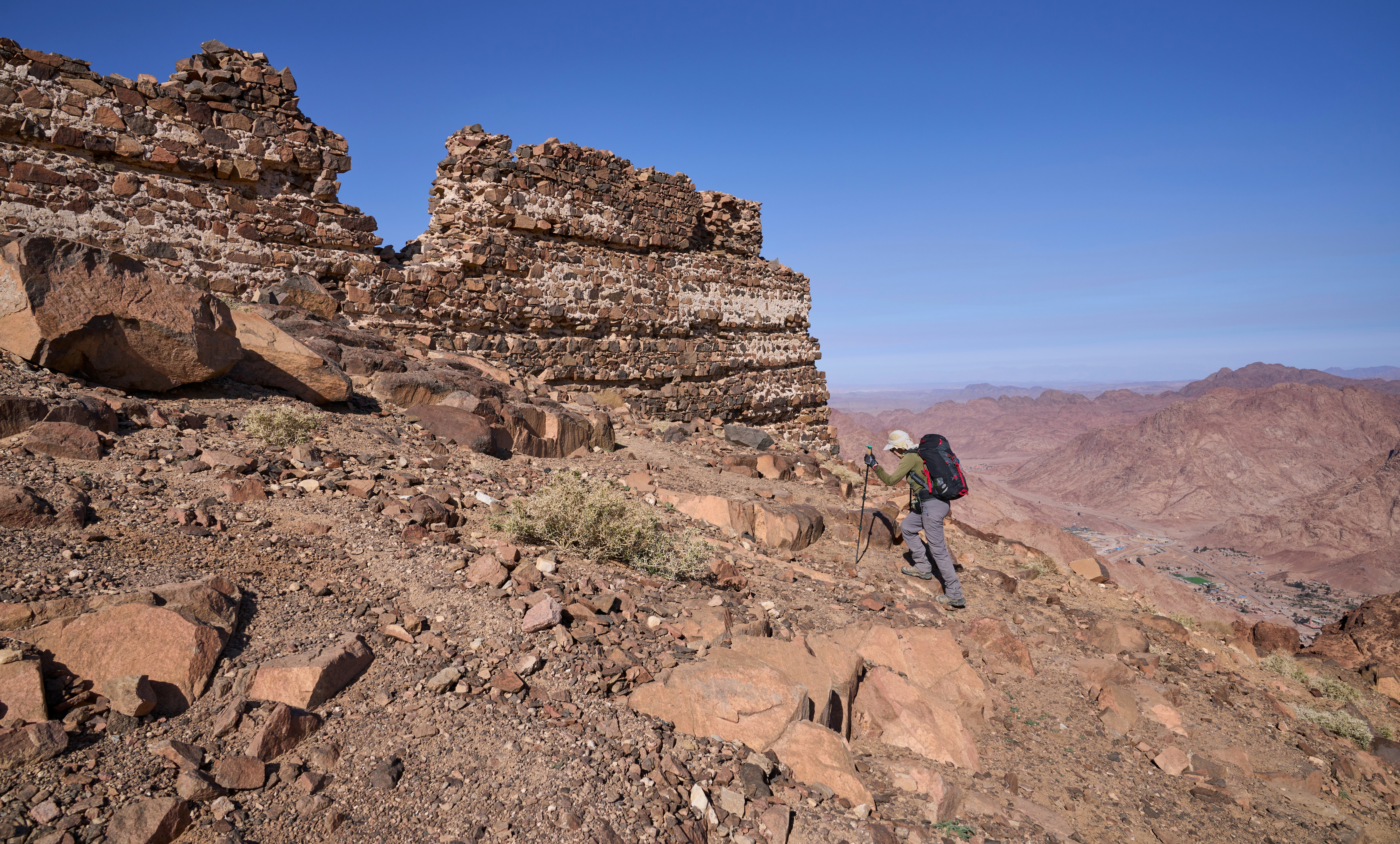 A hiker by the ruins at the summit of Gebel Abbas Pasha in the Sinai, Egypt.