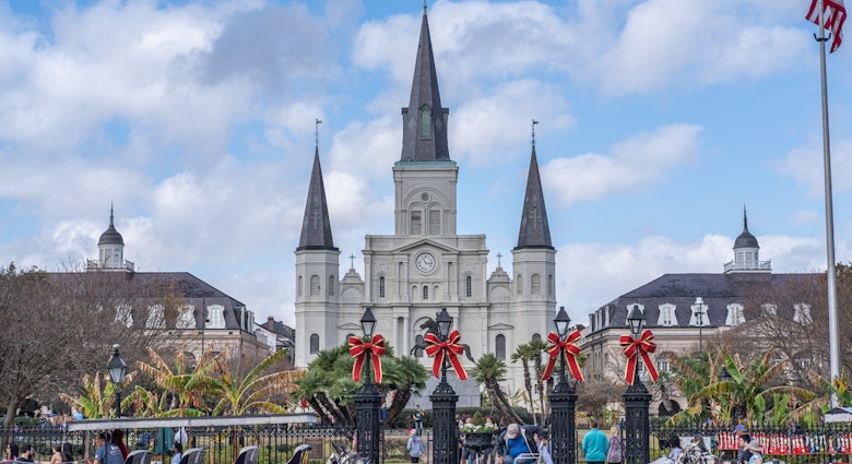 NEW ORLEANS, LA, USA - NOVEMBER 30, 2019: Cityscape photo with St. Louis Cathedral, the Cabildo, the Presbytere, mule-drawn carriages, and Christmas decorations on Jackson Square, License Type: media, Download Time: 2025-11-12T14:11:06.000Z, User: clairenaylor, Editorial: true, purchase_order: 65050 - Digital Destinations and Articles, job: online editorial, client: New Orleans Christmas, other: Claire Naylor