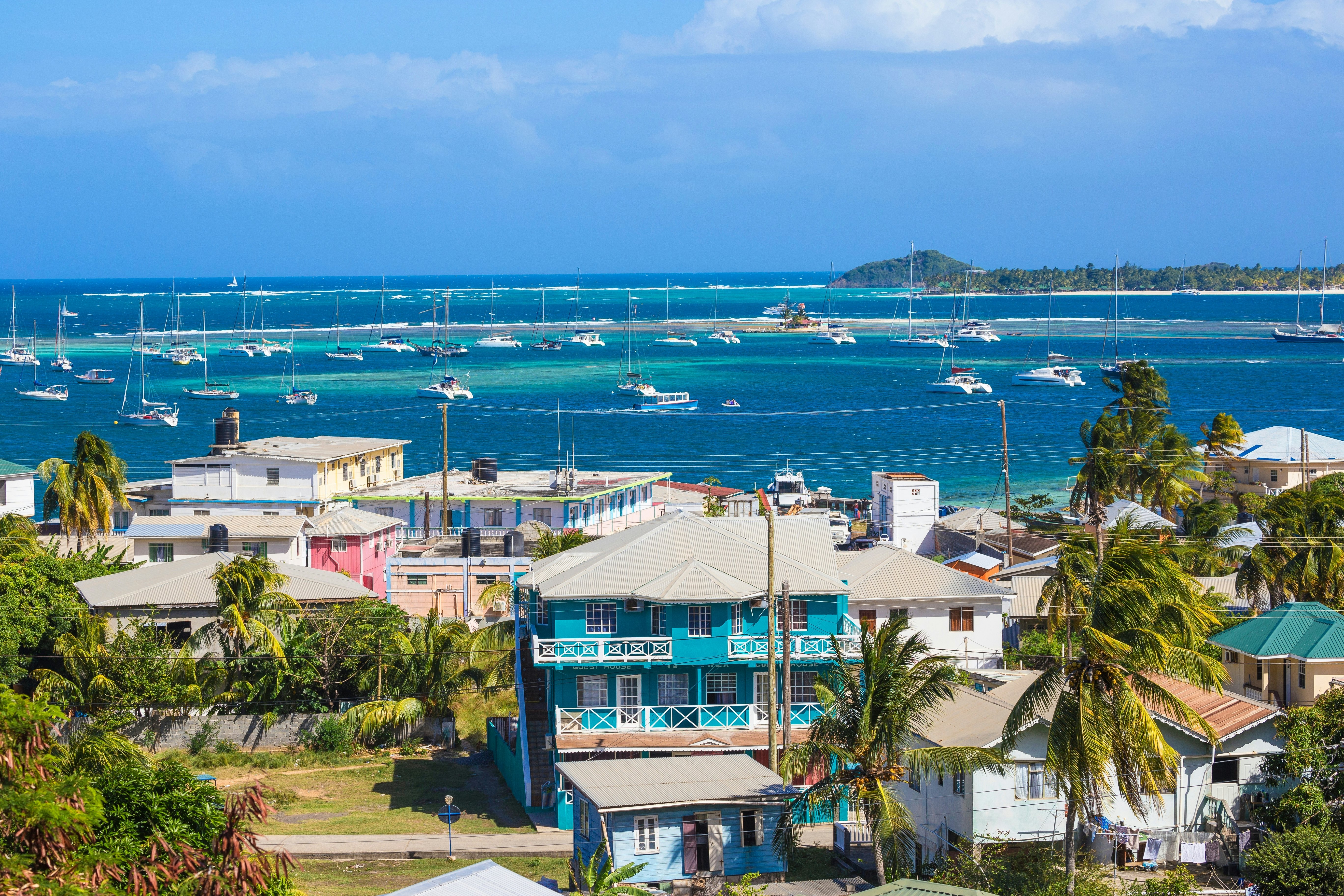 View of Clifton and Clifton harbour, Union Island, with Palm Island in the distance, The Grenadines, St. Vincent and The Grenadines