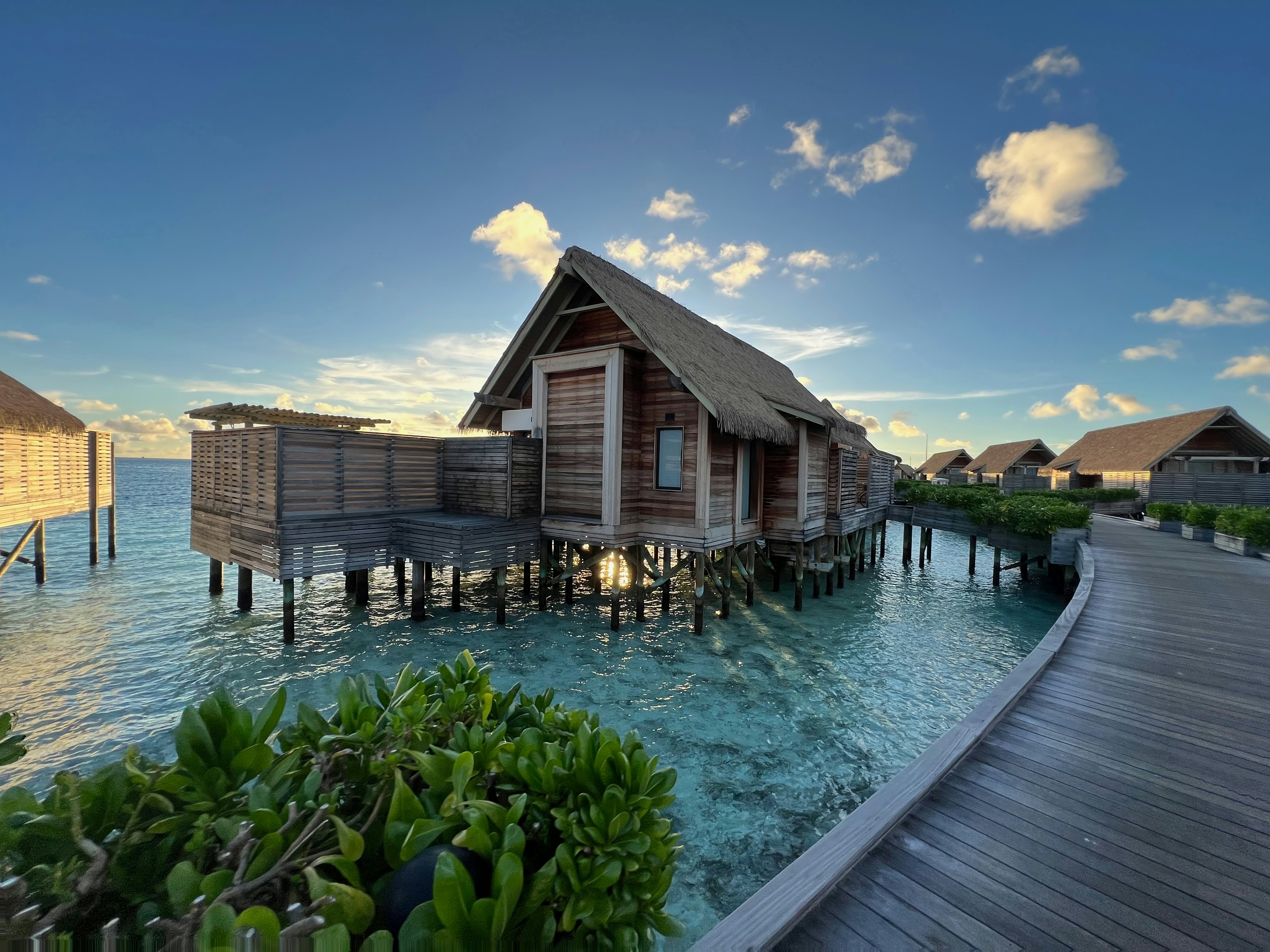 Overwater villas on along a wooden walkway
